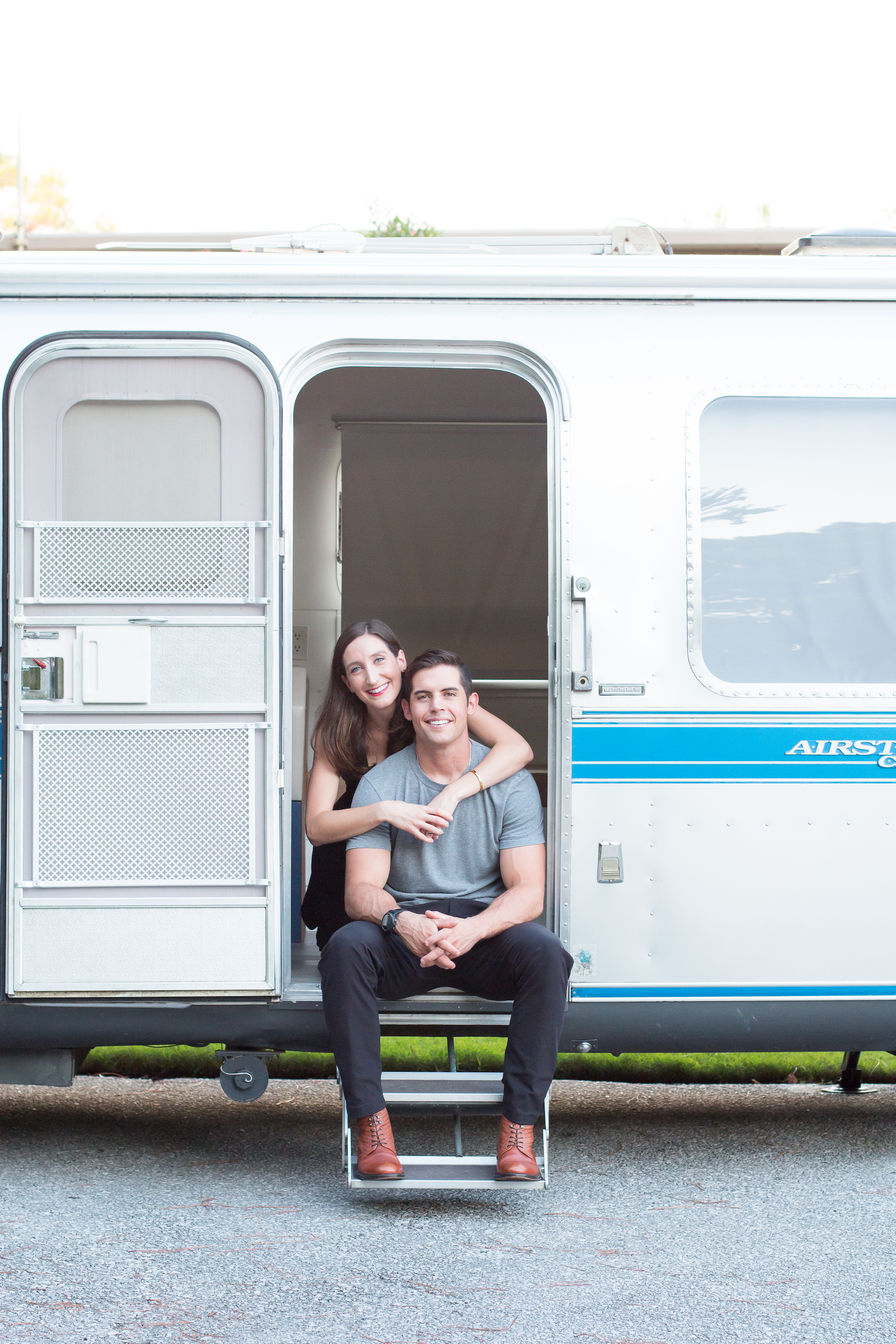 Christina and Mack Griffin pose in front of their Airstream.