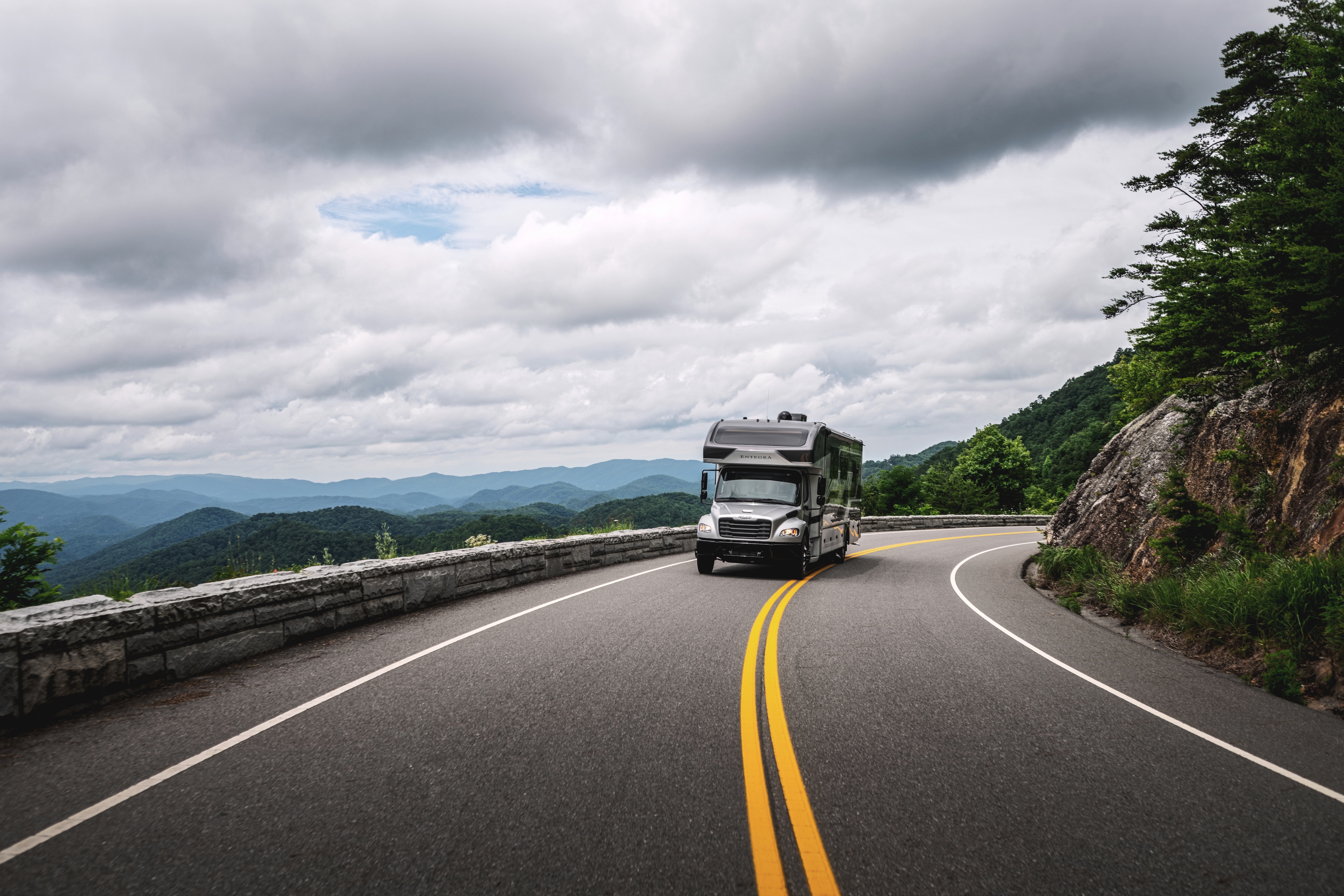 Entegra Accolade driving down a mountain road