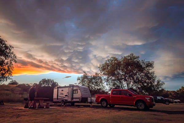 The Alison and Jason Takacs family's Jayco Jay Flight at a campground during sunset