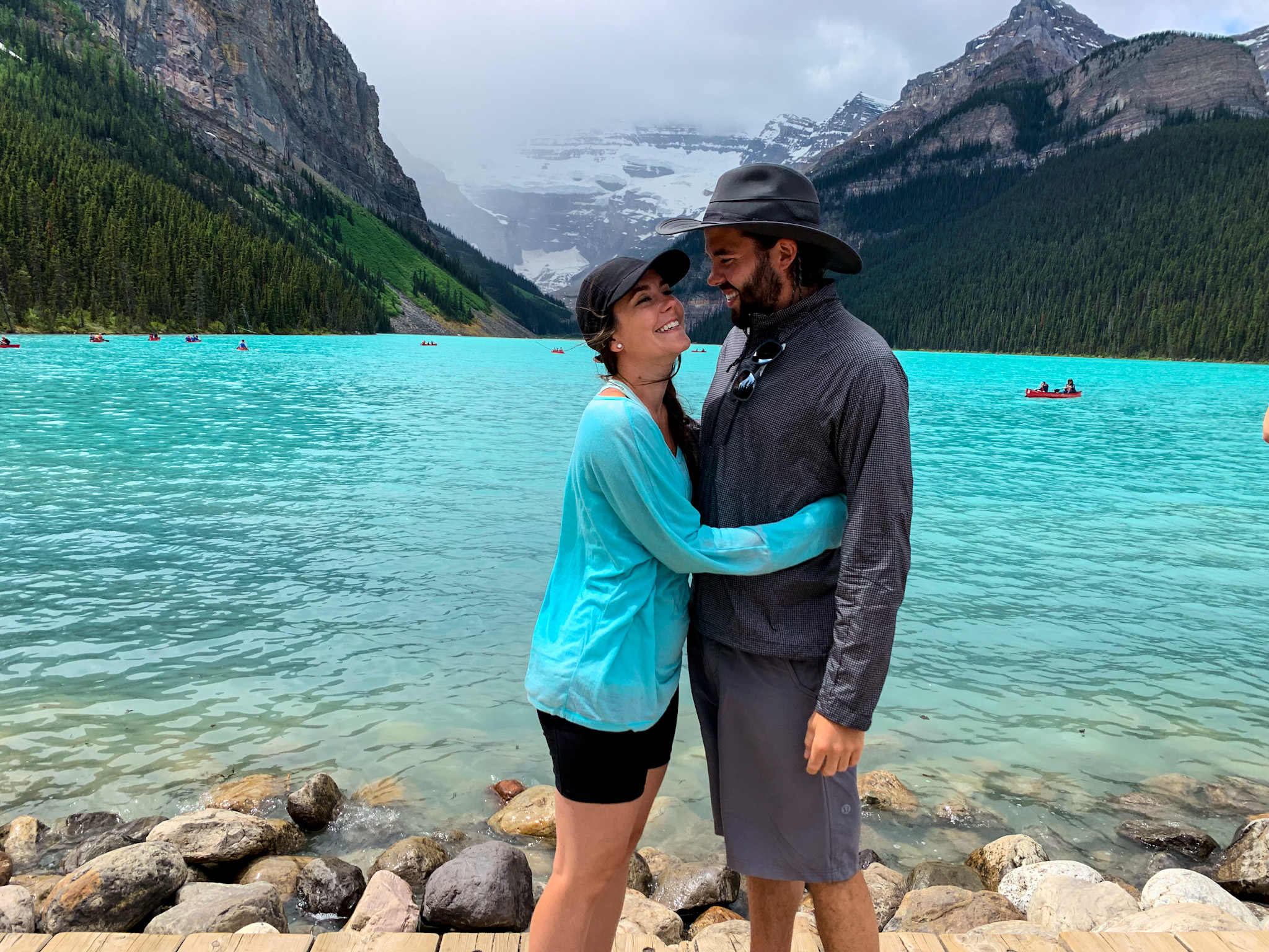 Jason and Dawn hugging in front of Lake Louise in Banff National Park.