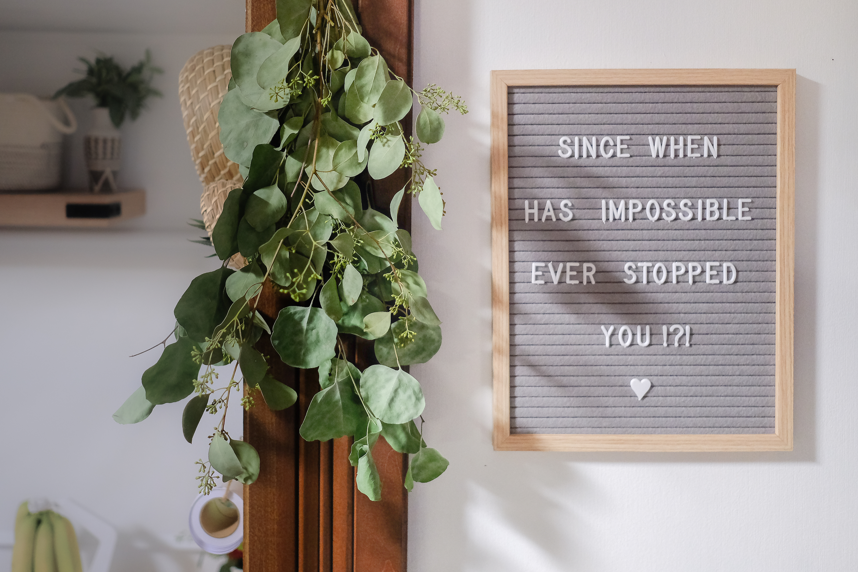 A sign reading "Since when has impossible ever stopped you?"