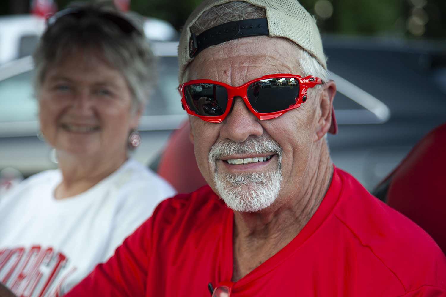 An older man and a woman smiling for the camera. 