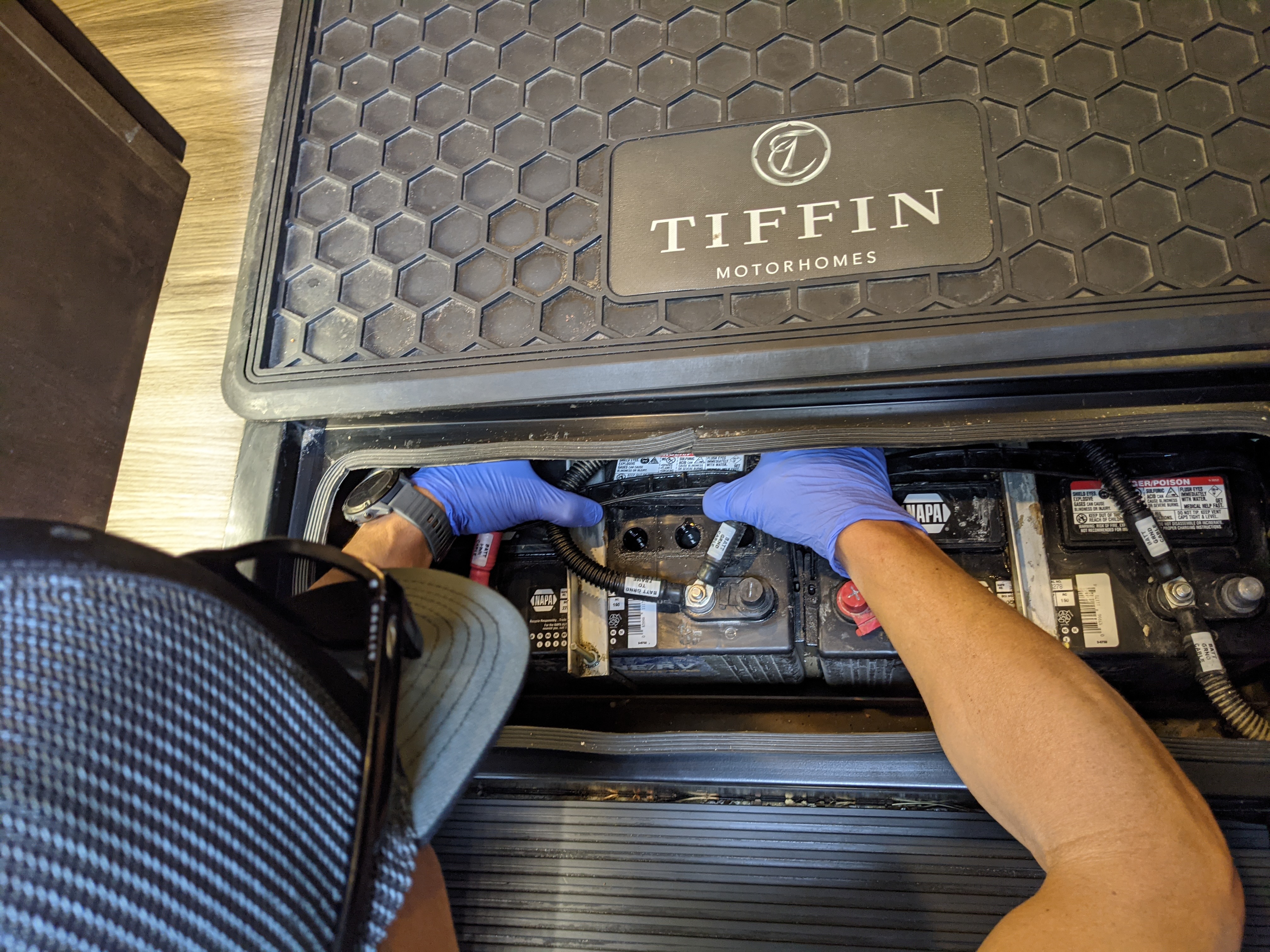 Dustin Bauer examining his RV battery