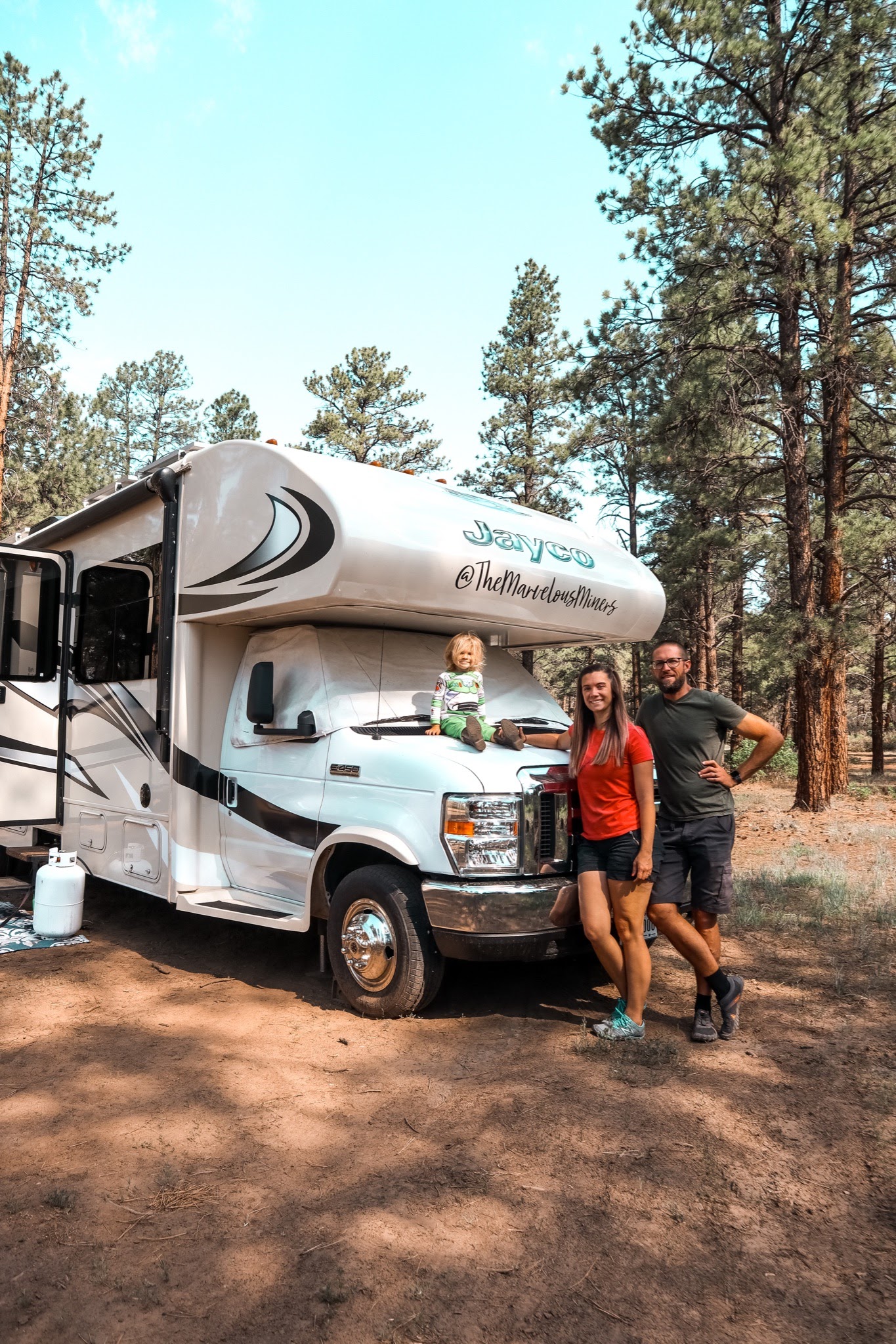 Holly Miner, her husband and their son at a campground with their Jayco Greyhawk.