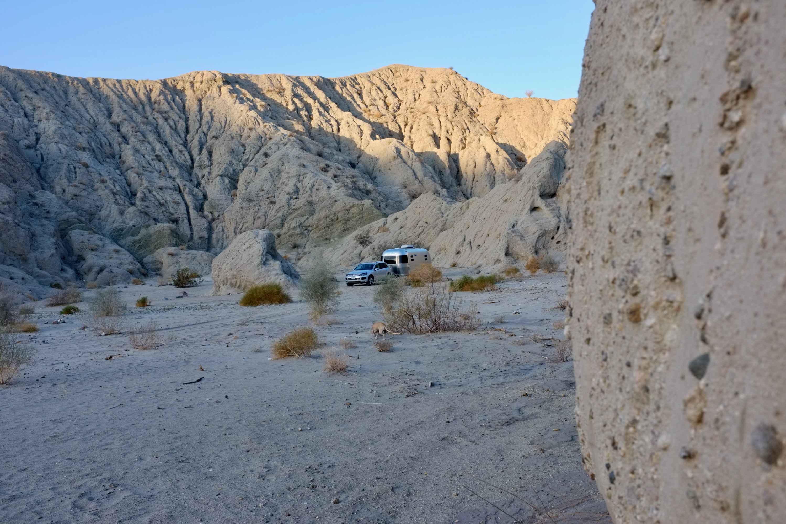 Dr. Na's RV parked in a sandy desert. 
