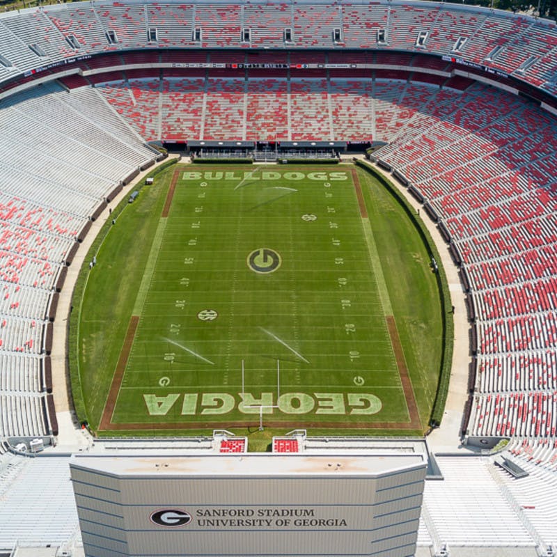 Georgia football field with stands in stadium. 