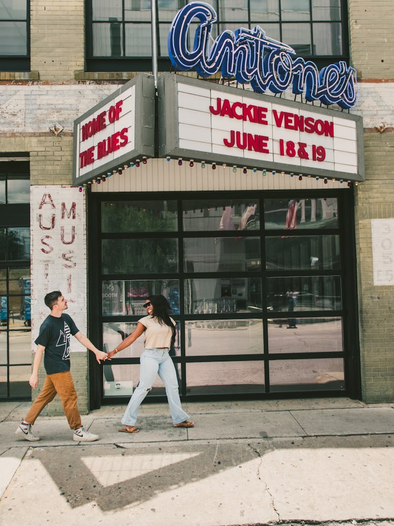 Jessy and Jim holding hands walking through Austin, Texas