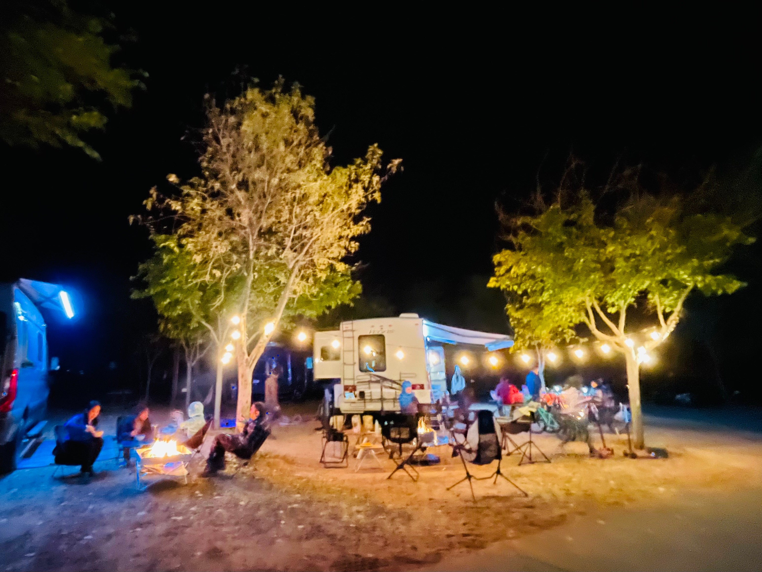 People sitting in camping chairs at Brenda and Tiger's RV meetup