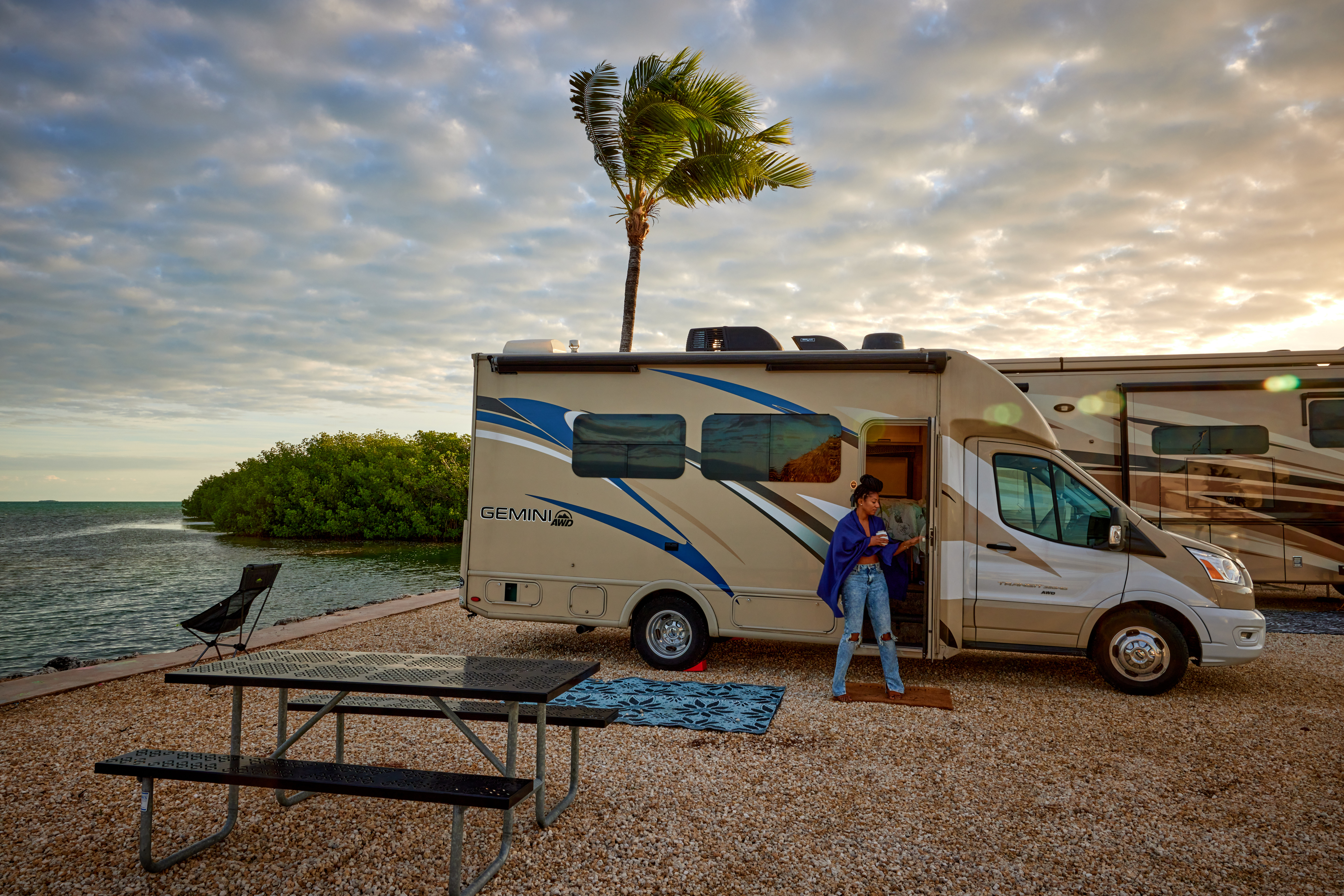 Travel writer Adrienne Jordan heads into her Thor Motor Coach Gemini Class B+ Motorhome while parked at the Fiesta Key RV Resort & Marina.