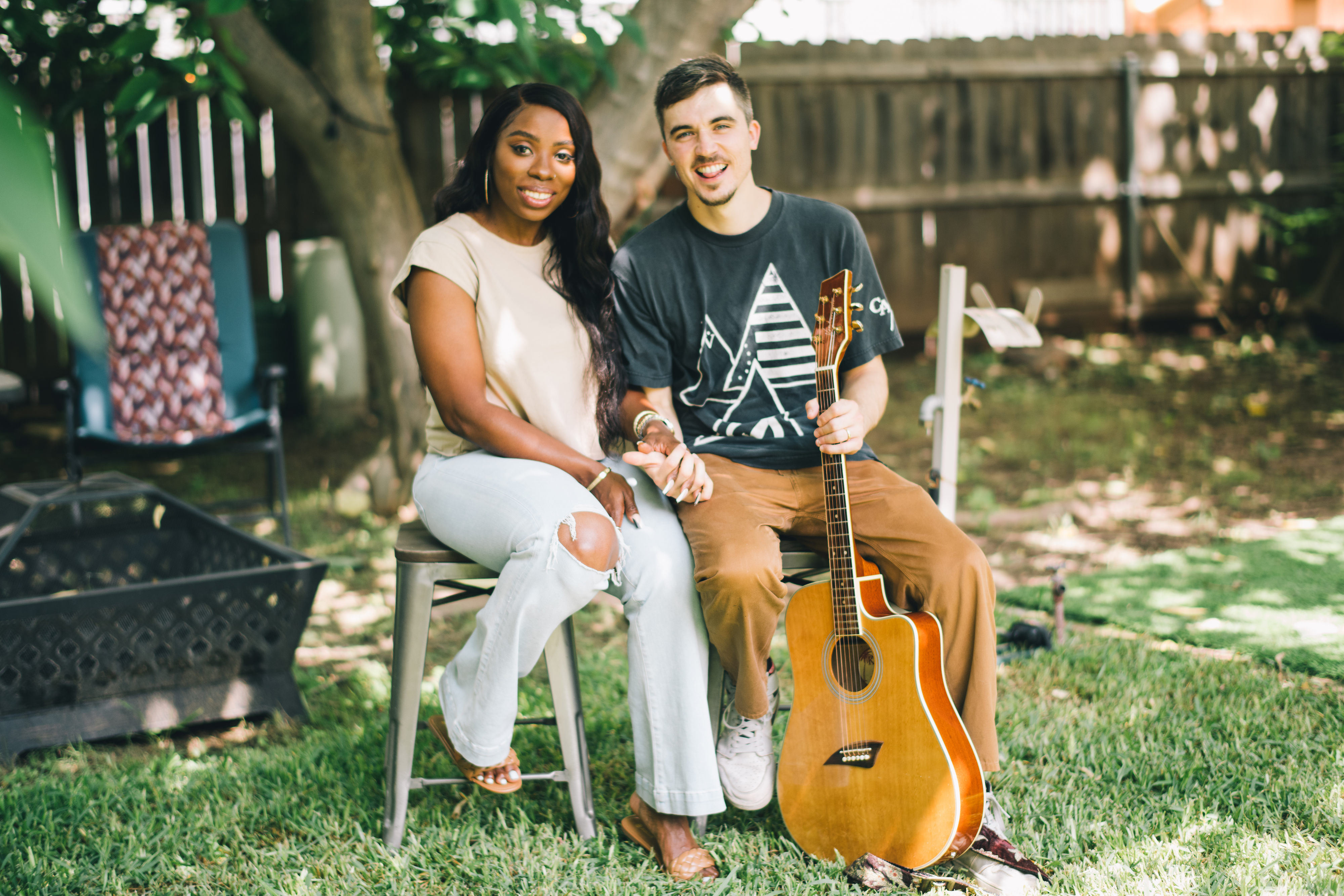 Jessy and Jim McFarlin holding hands and smiling outside