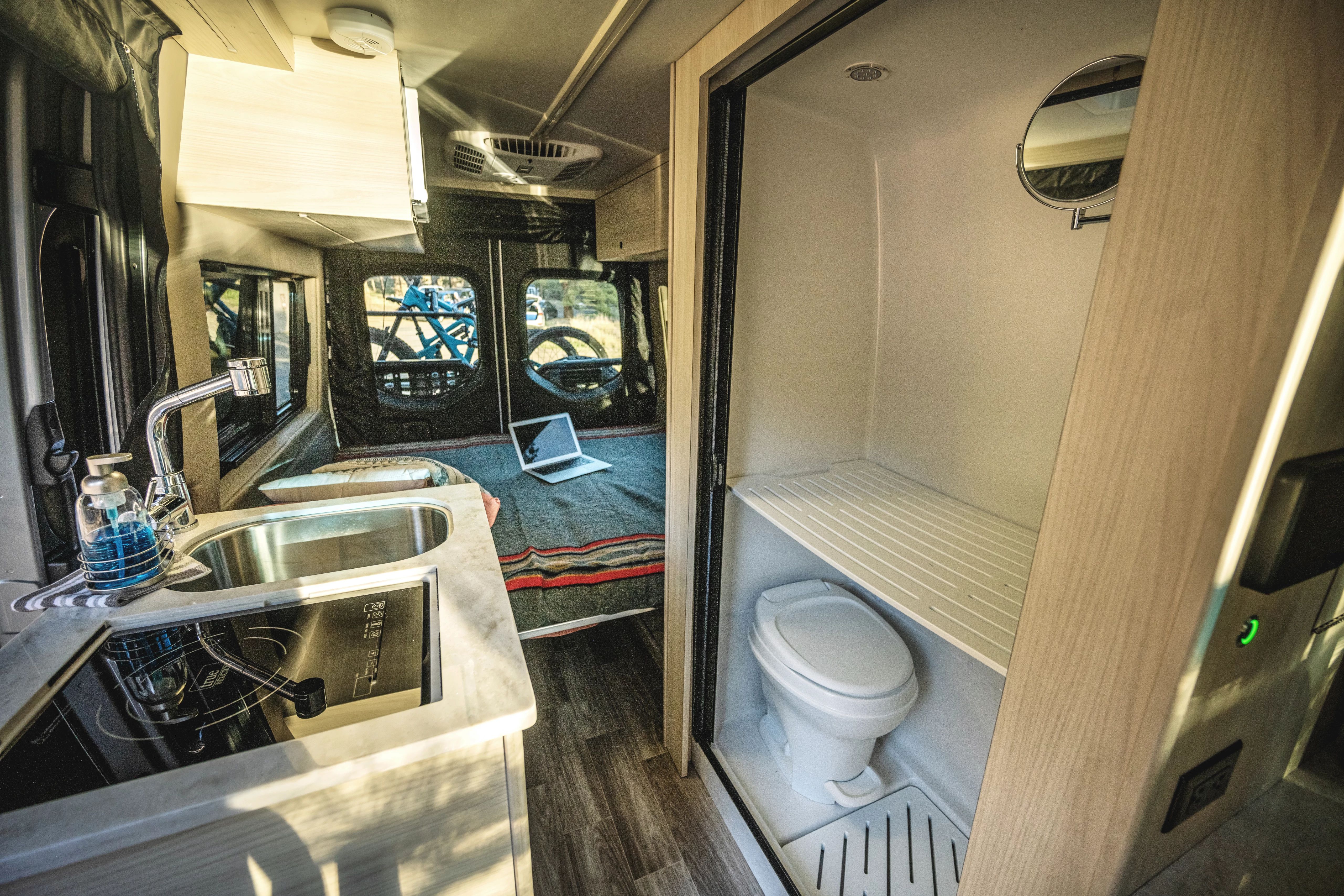 A bathroom inside of a Tiffin Cahaba class b camper van
