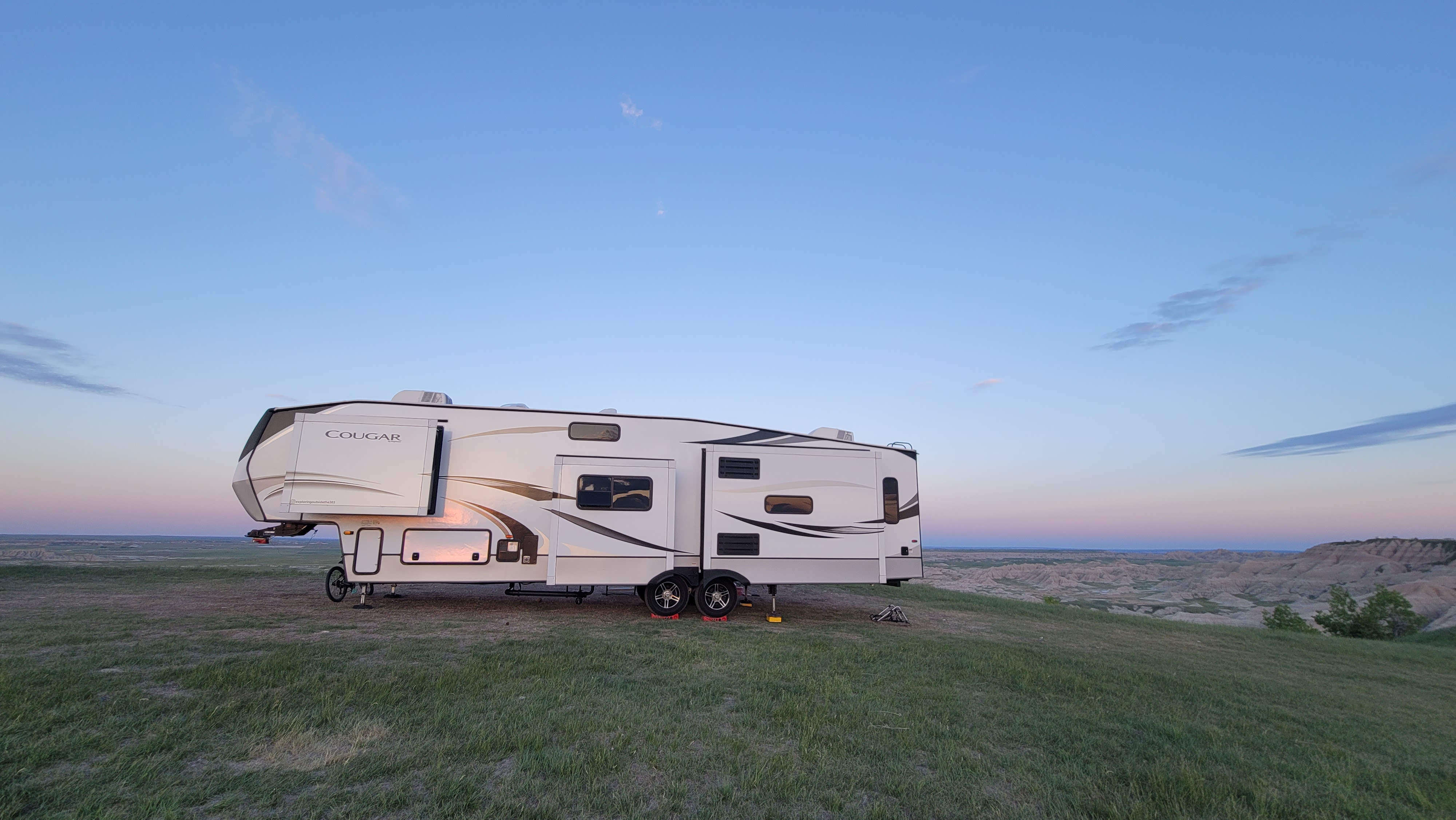 STEVE & KAYLEE TECHAU's Keystone Cougar boondocking in a field 