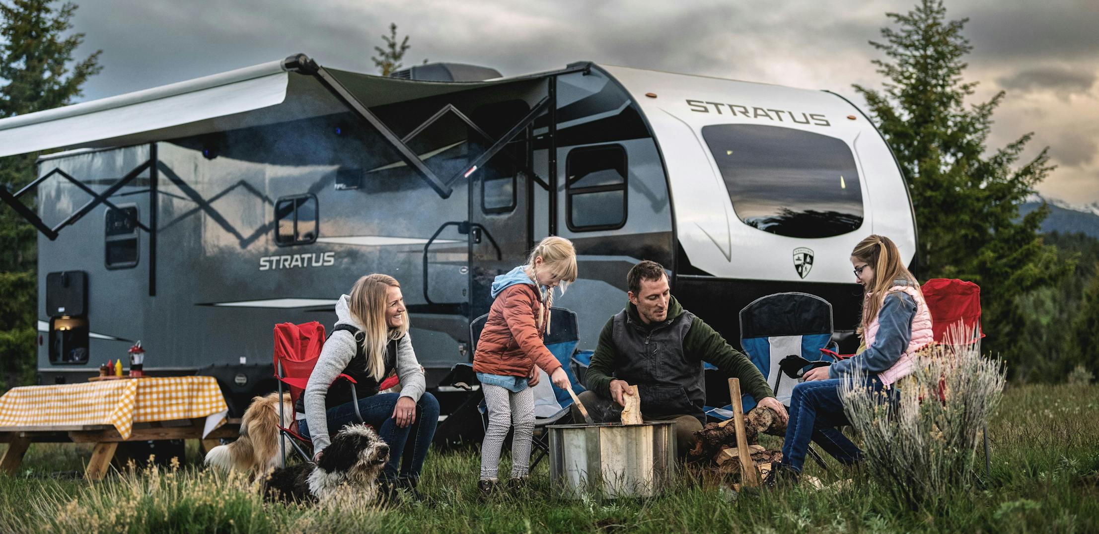 A family gathered outside a Venture Stratus 