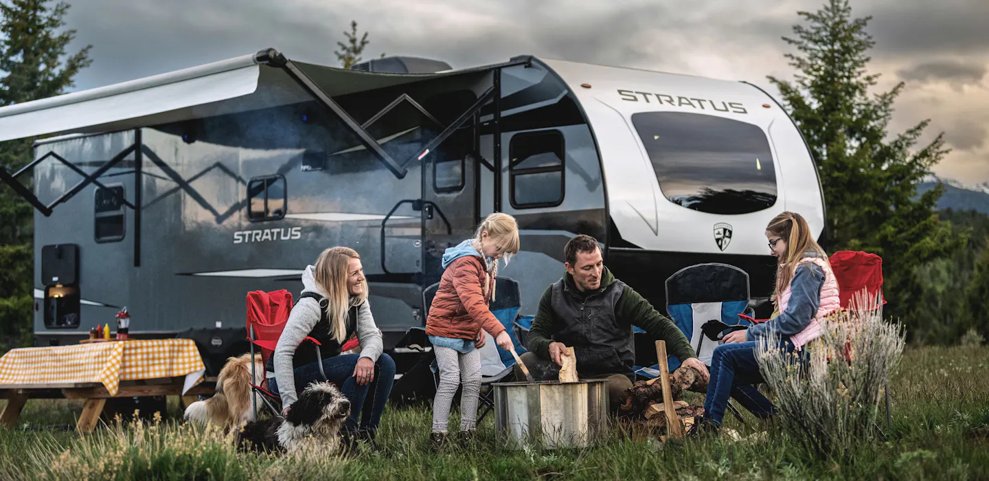 A family gathered outside a Venture Stratus 