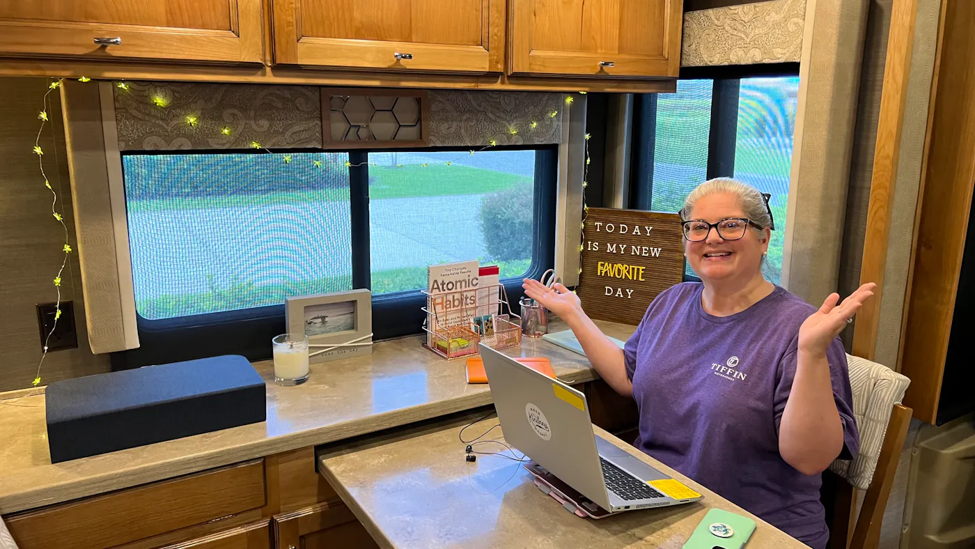 Tiffany Dunagan sitting at her designated workspace inside her Tiffin Motorhome RV