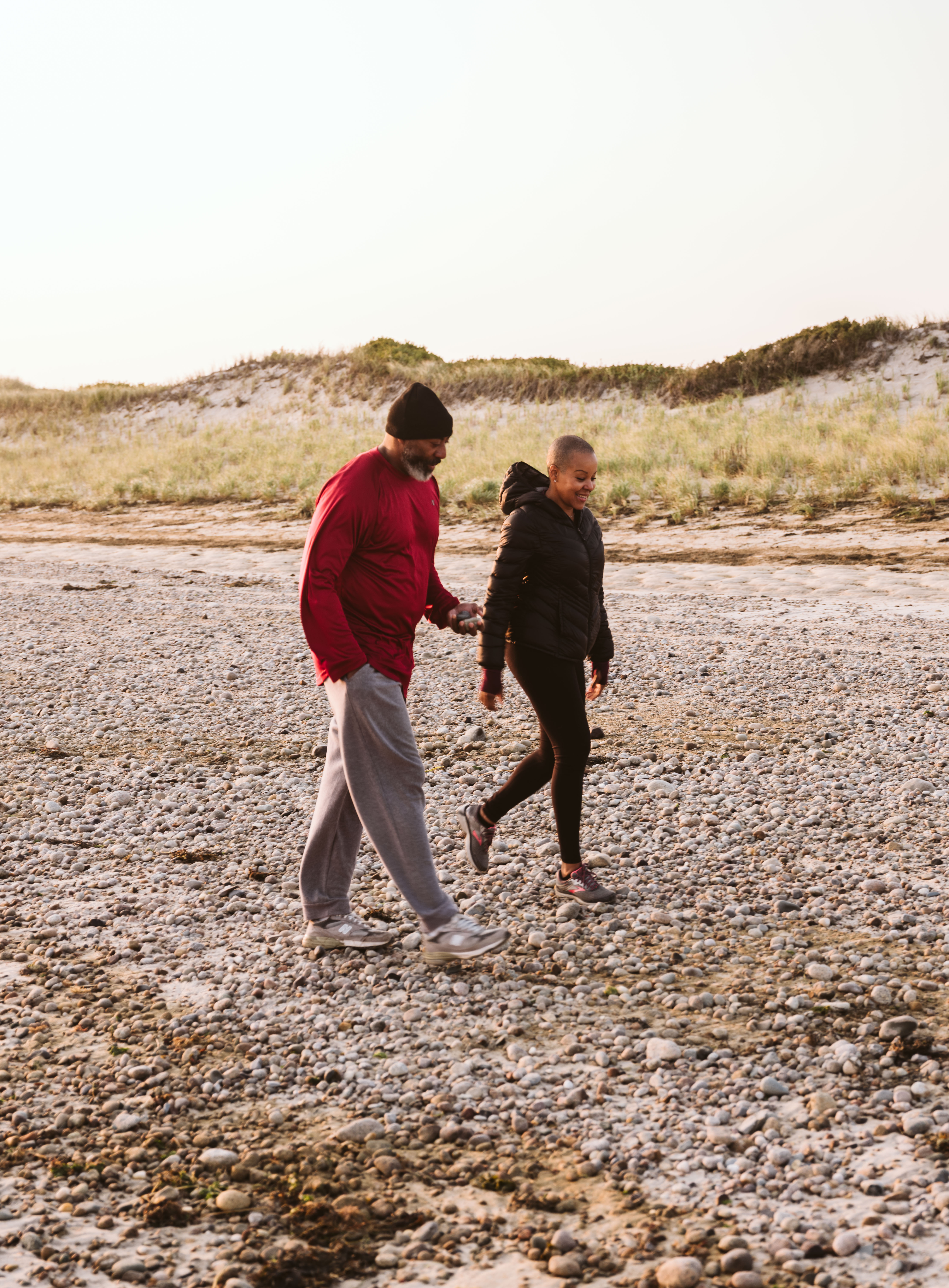 Sonya Lowery and Ray Young taking a walk on the beach in Cape Cod.