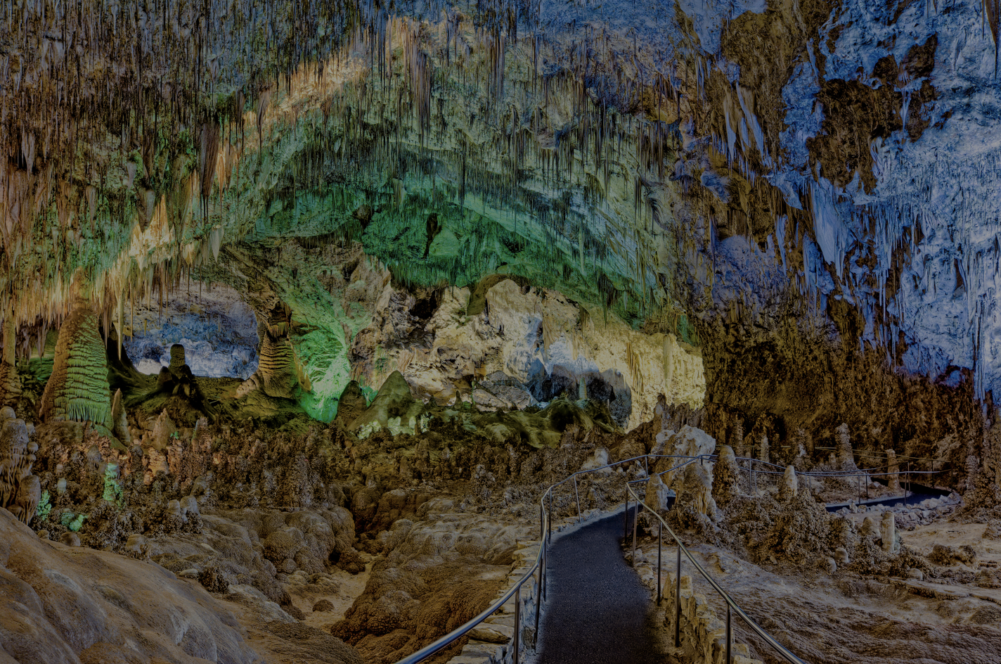 Green and blue lights inside Carlsbad Caverns National Park