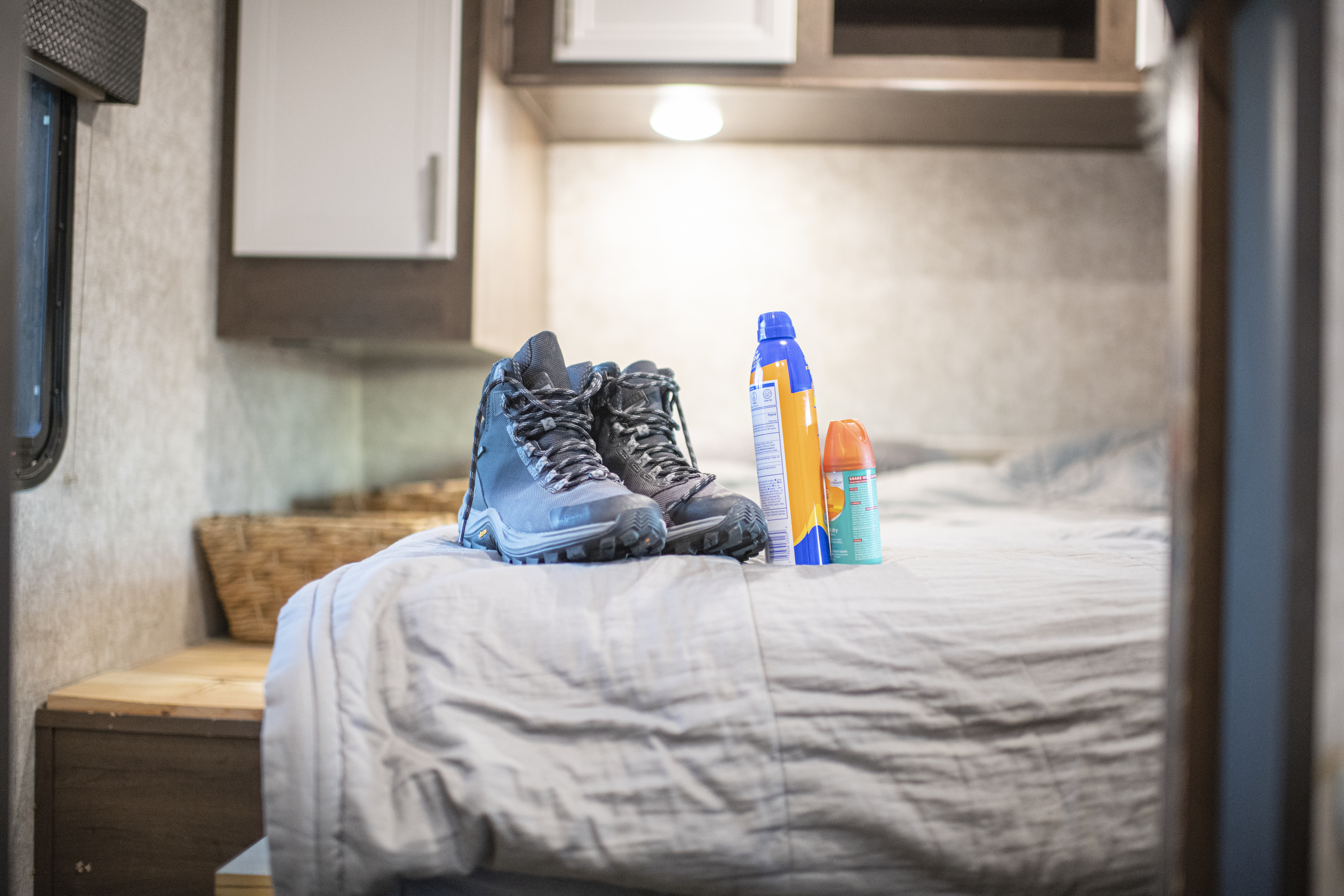 A pair of hiking boots, but spray and sunscreen 