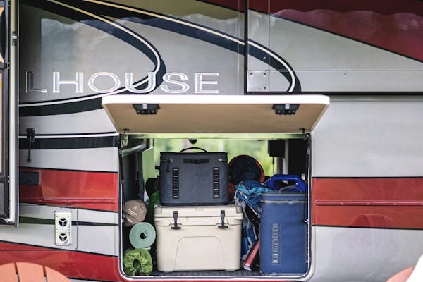 Camping gear in an garage storage compartment