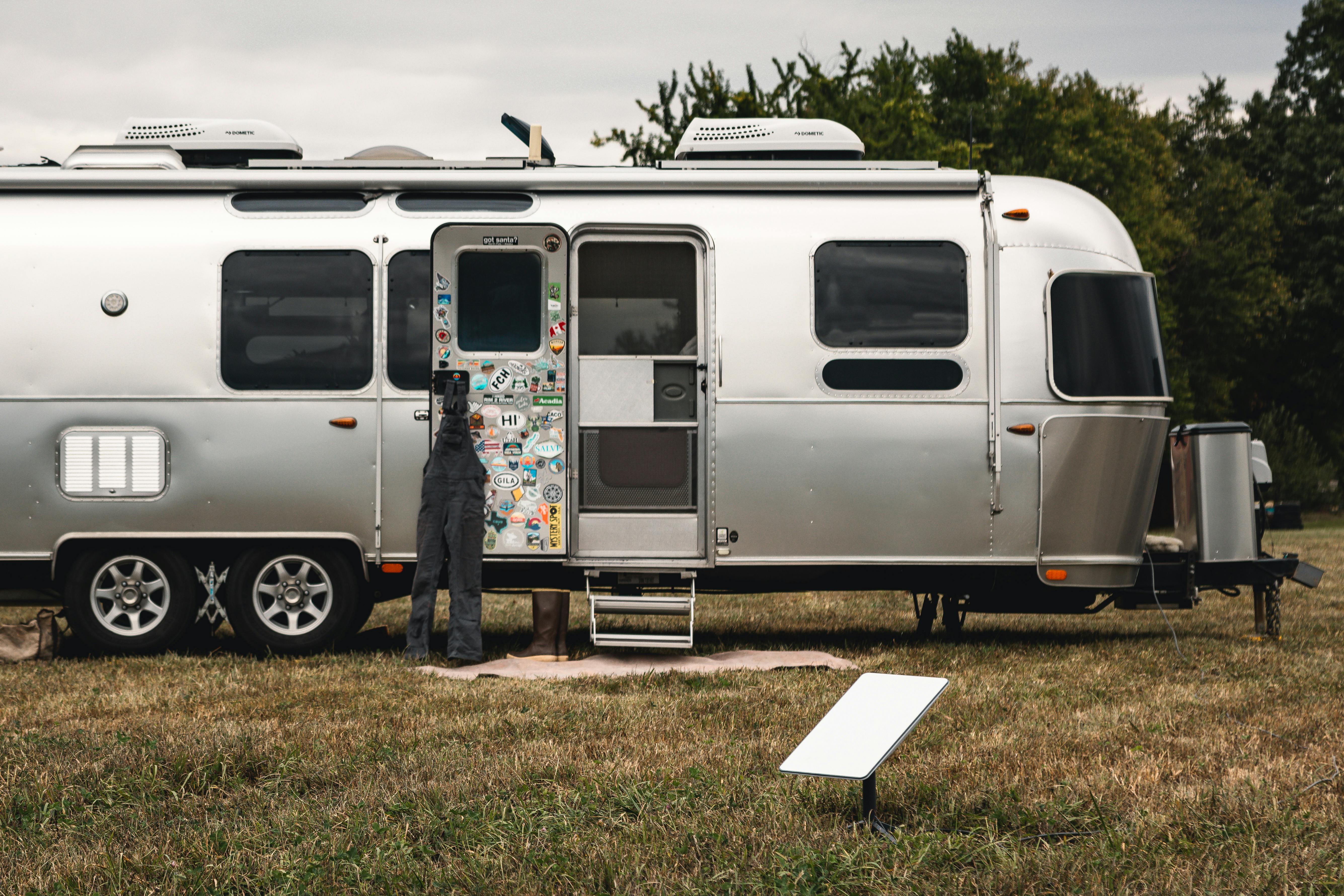 Karen Blue's Airstream next to a portable solar dish