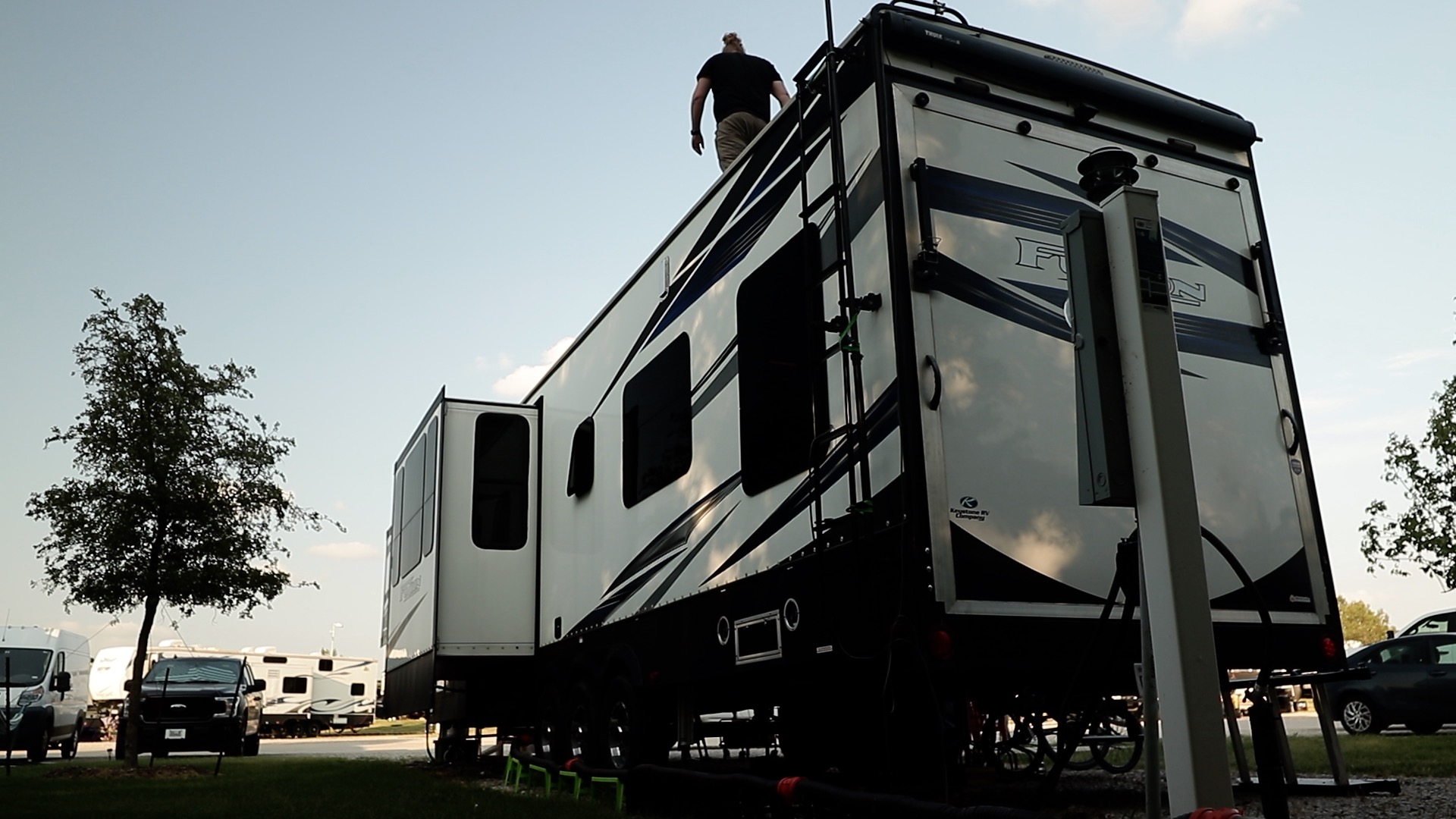 Andy Murphy on top of his stationary RV