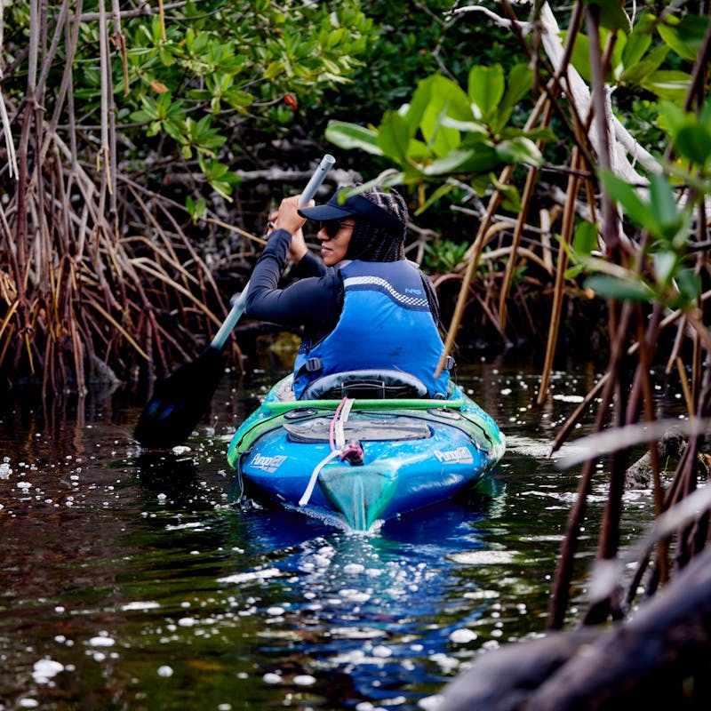 Travel writer Adrienne Jordan kayaks in mangroves in the Florida Keys.