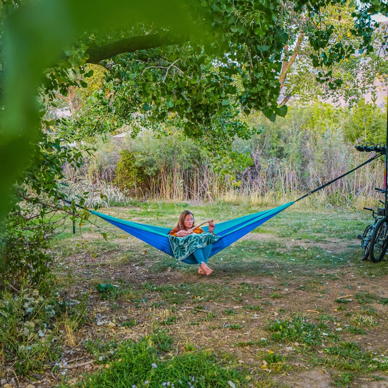Renee Tilby's child in a parachute hammock