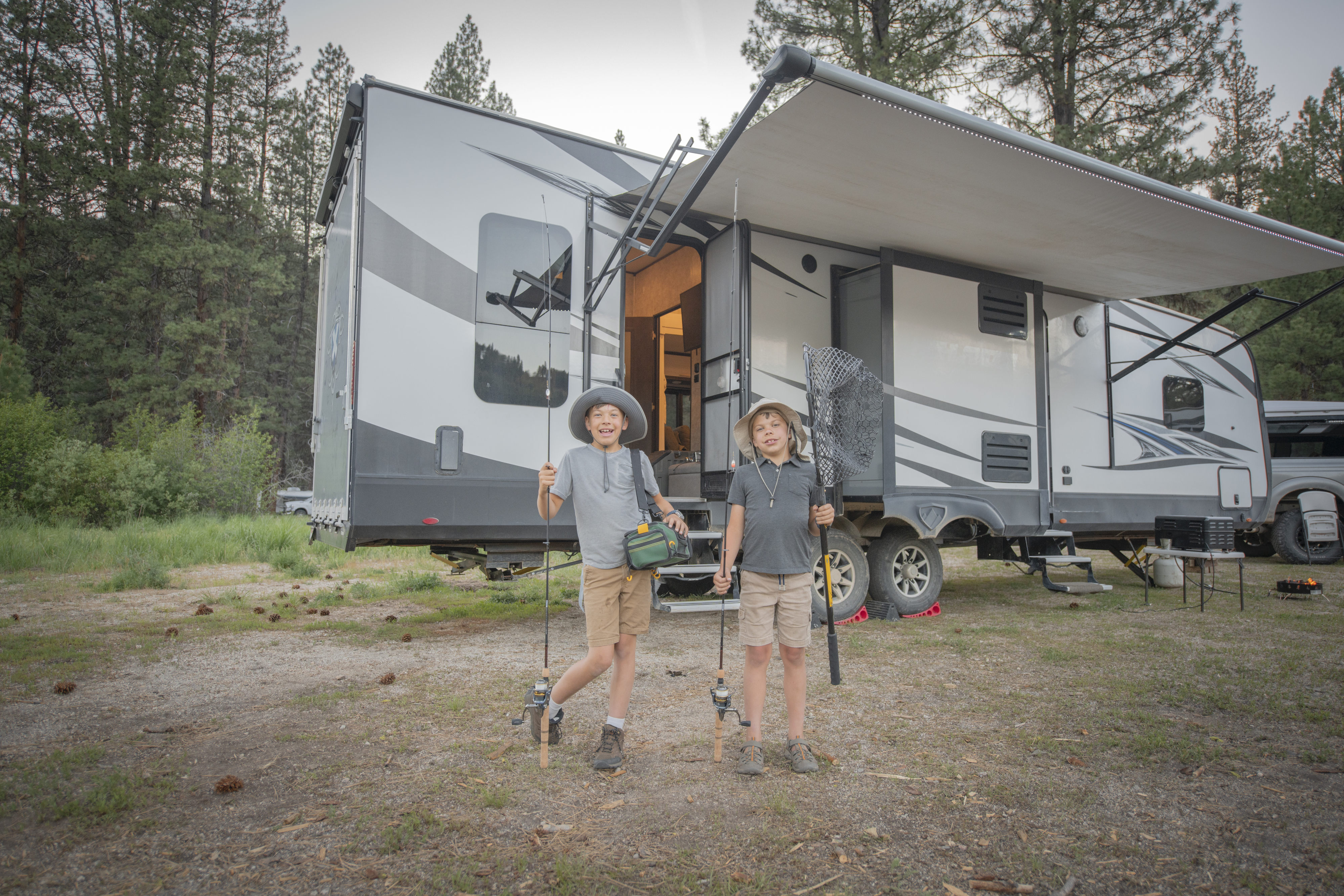 Chelsea Day's kids holding up fishing poles
