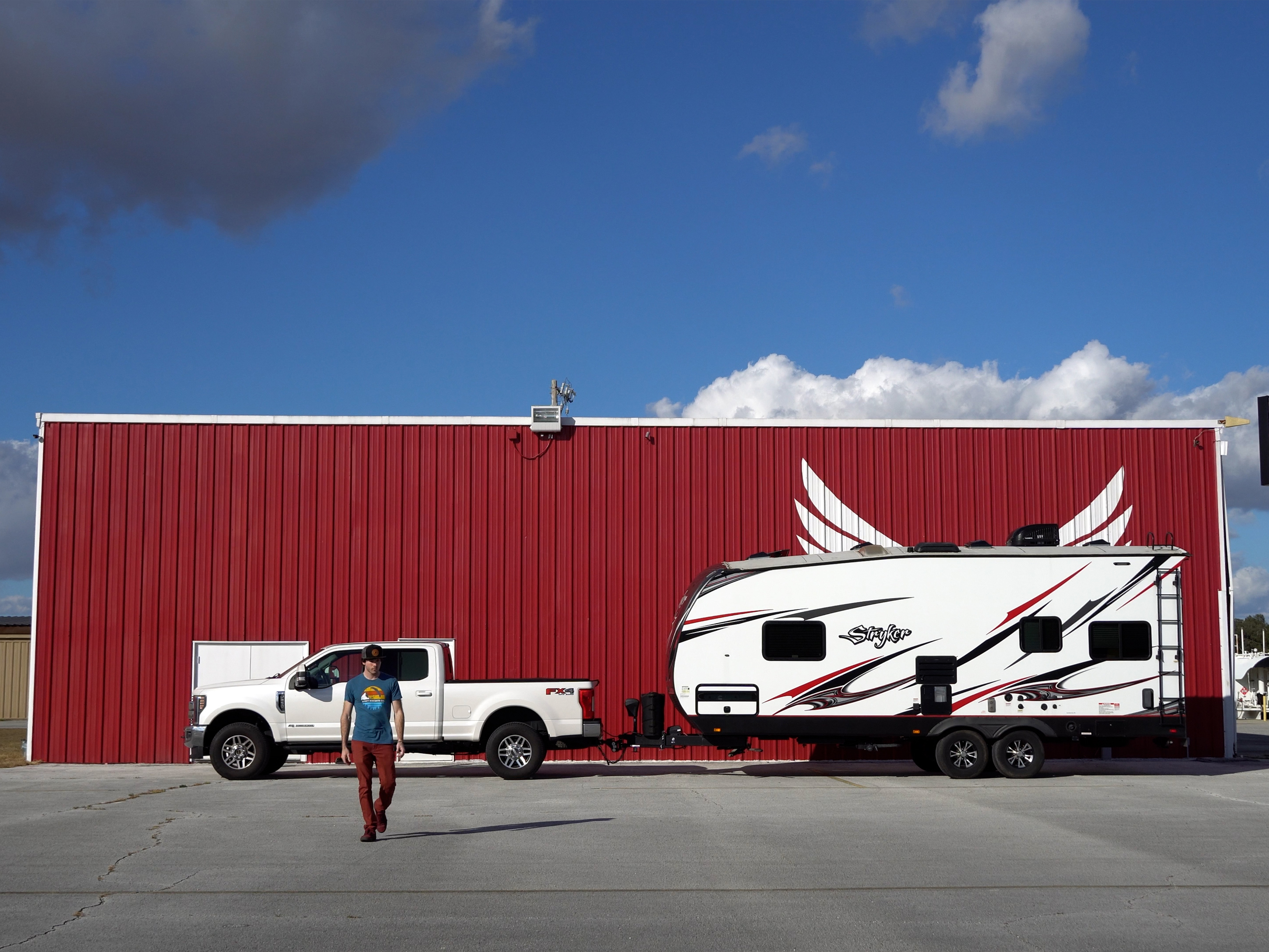 Tucker Gott walks away from his parked Cruiser Stryker RV.