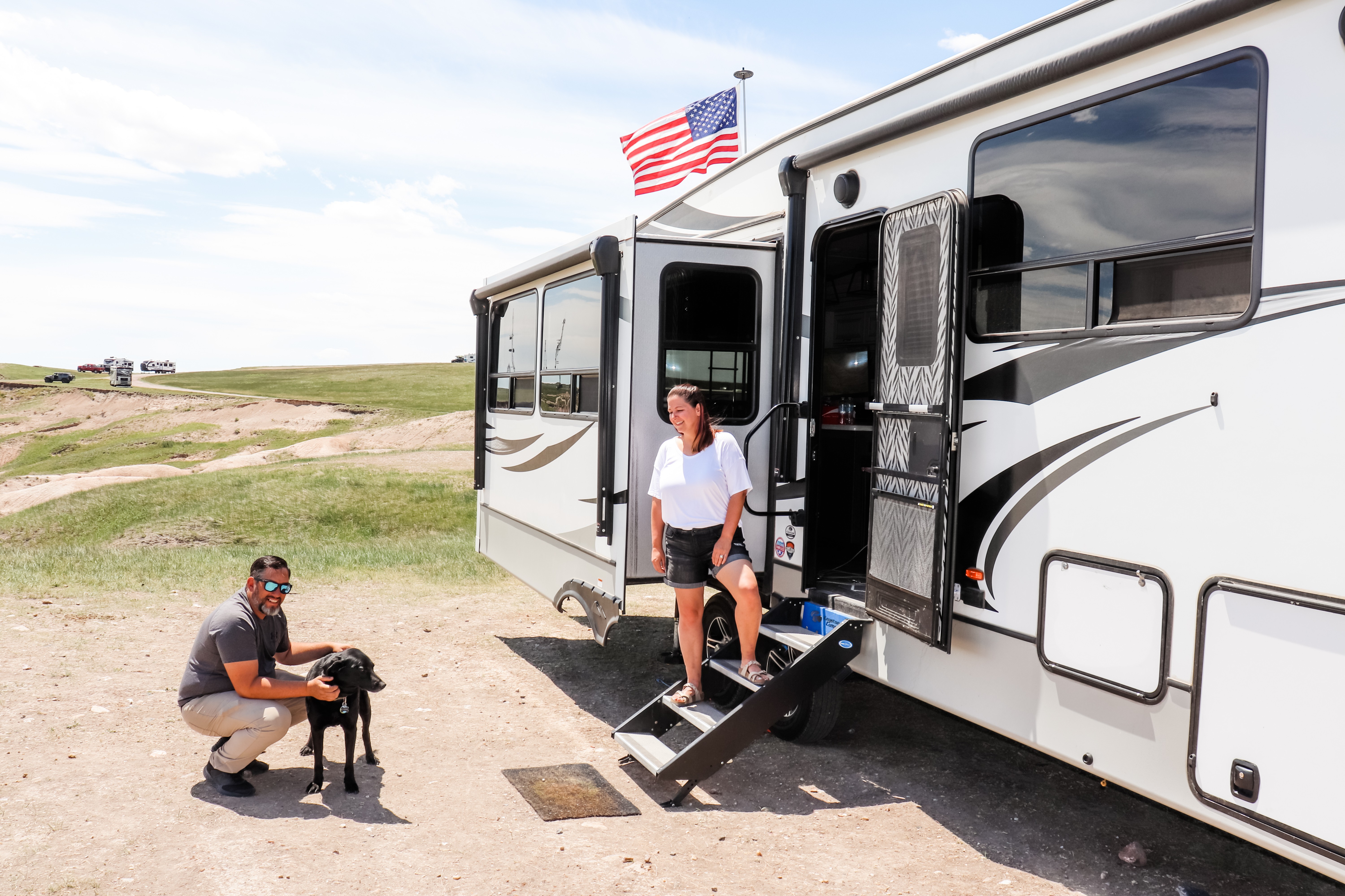 Kaylee and Steve Techau in front of their Keystone Cougar