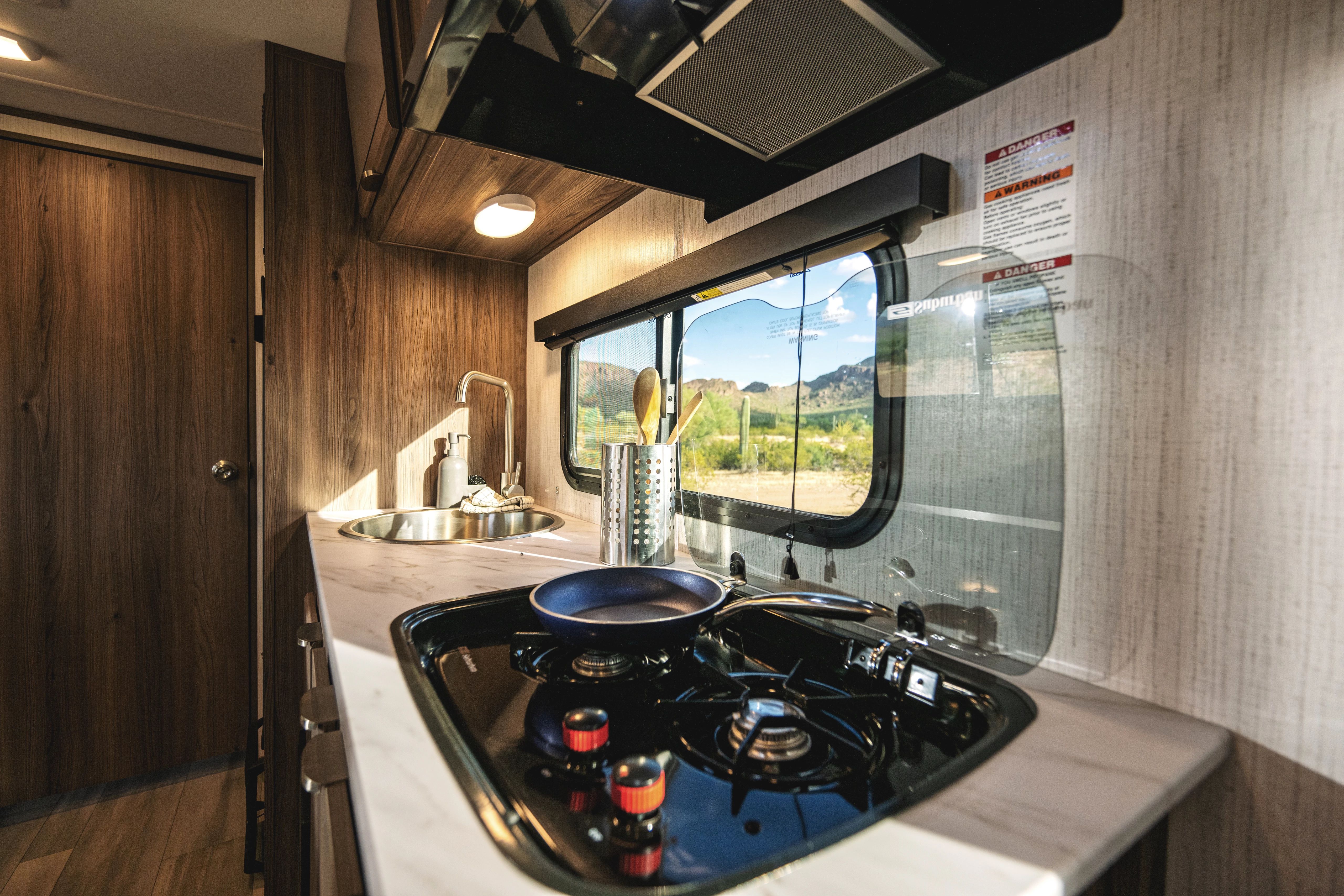 Stove top in a KZ Cruiser Hitch Lightweight Travel Trailer 