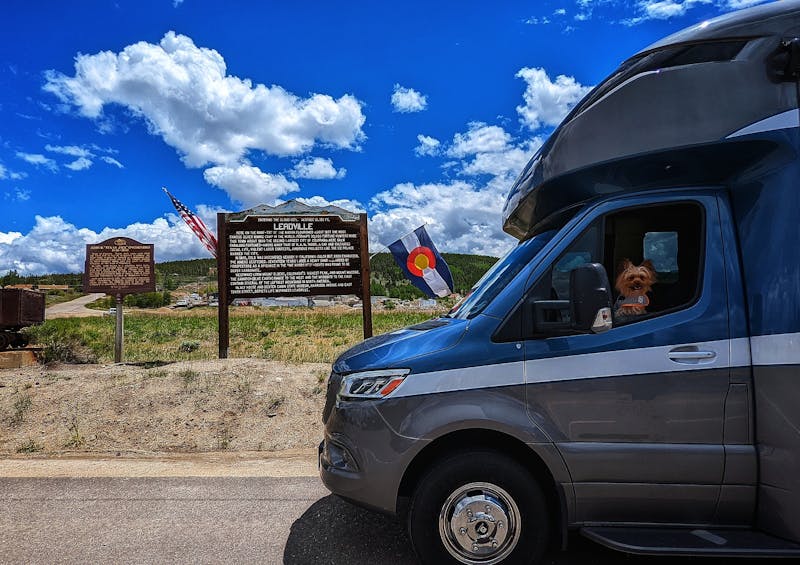 Dustin and Sarah Bauer's RV parked in front of a sign for Leadville.