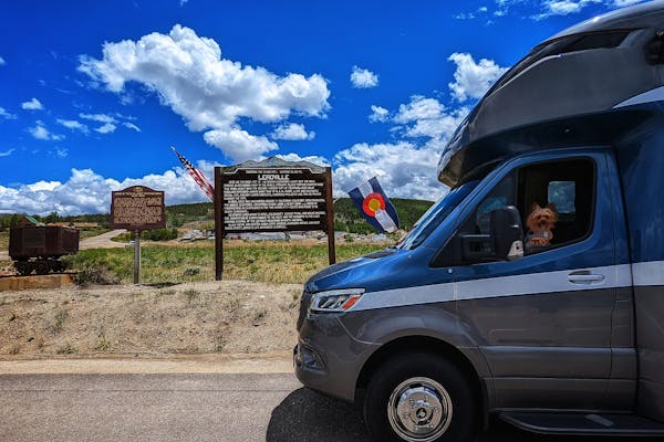 Dustin and Sarah Bauer's RV parked in front of a sign for Leadville.