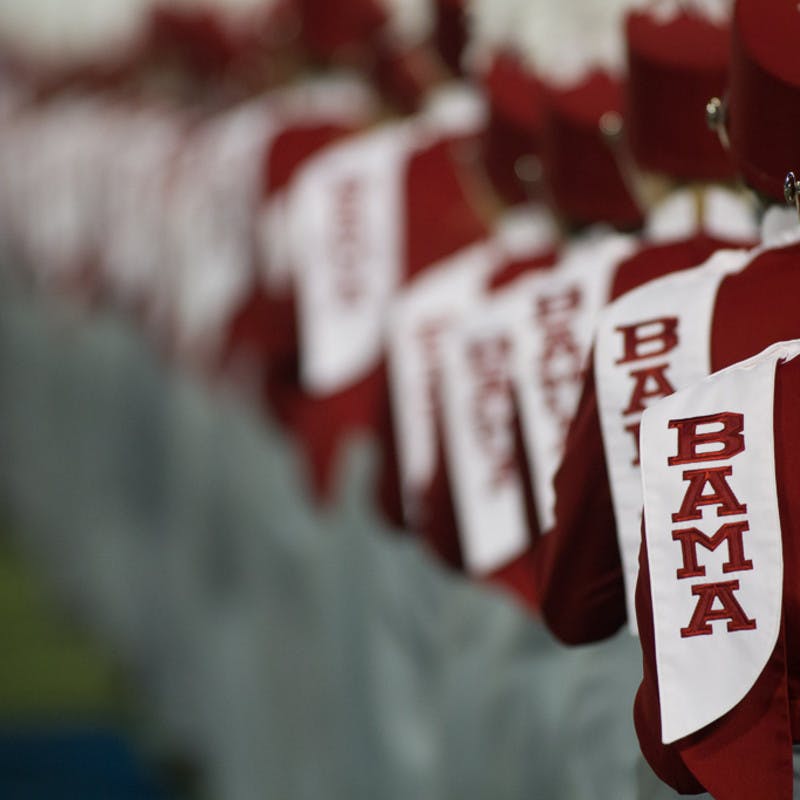 Alabama marching band marching away, in full uniform. 