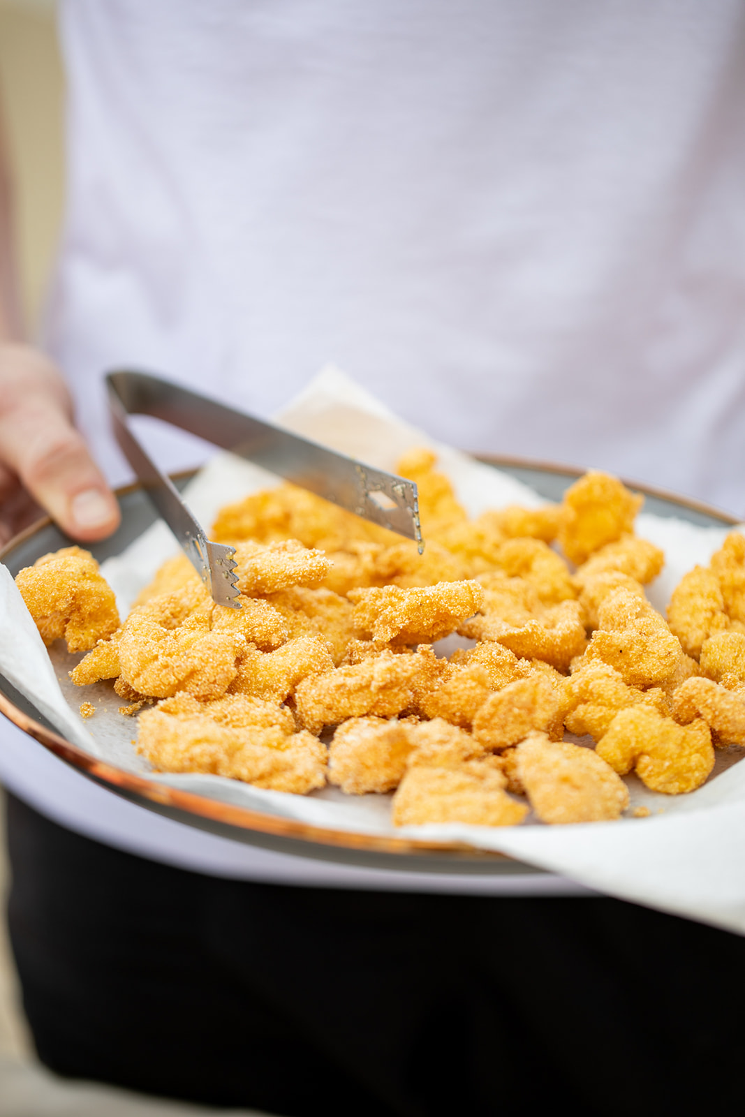 A platter of golden fried shrimp.