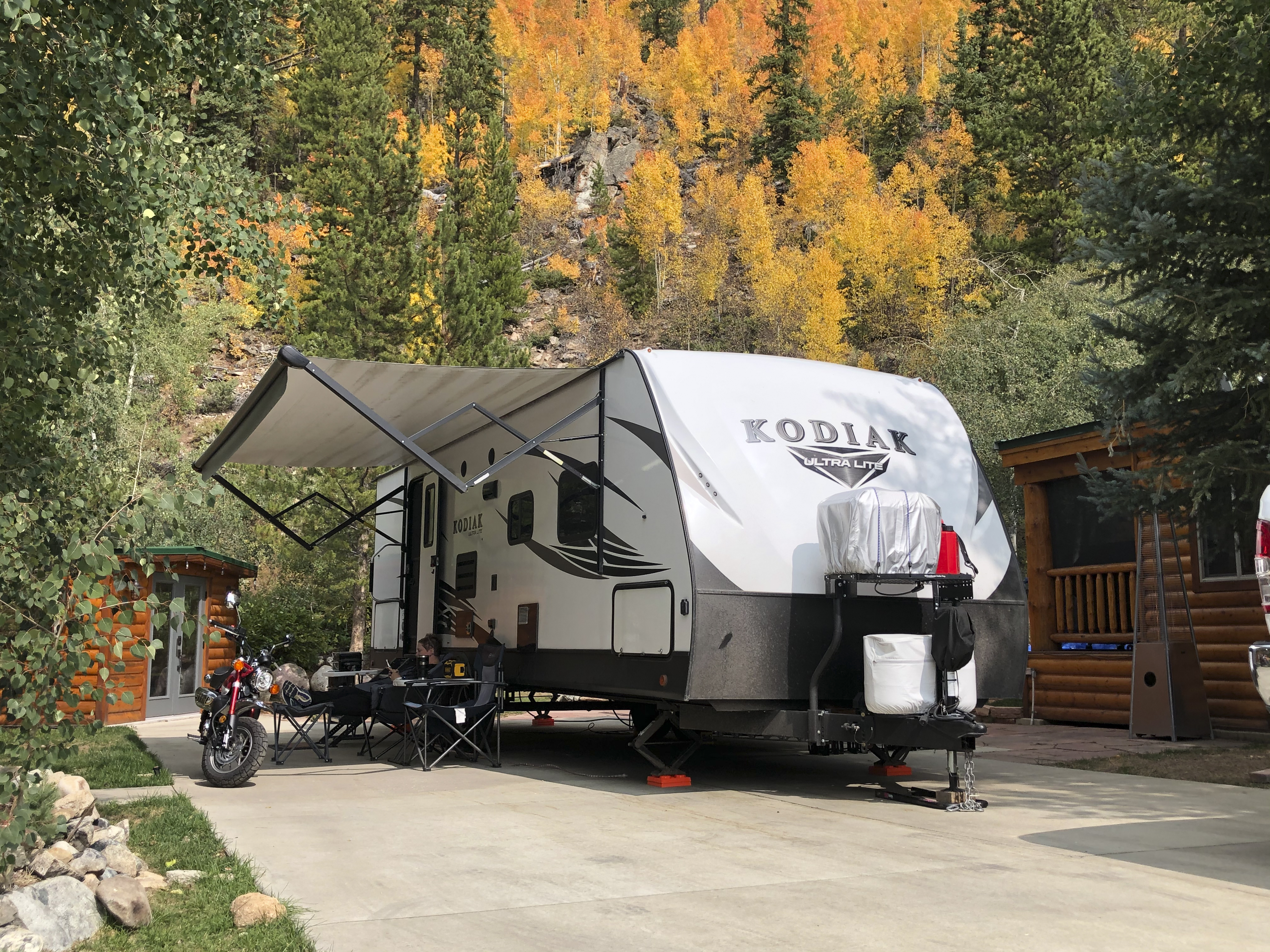 Abby Booth's Kodiak travel trailer parked at a campsite.
