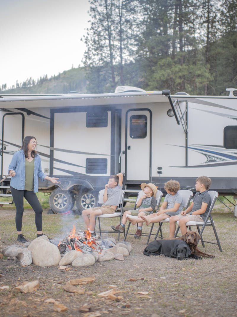 Chelsea Day talking to her four boys outside of their Highland Ridge RV