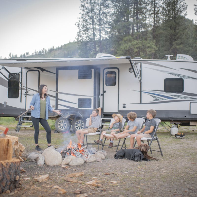 Chelsea Day talking to her four boys outside of their Highland Ridge RV