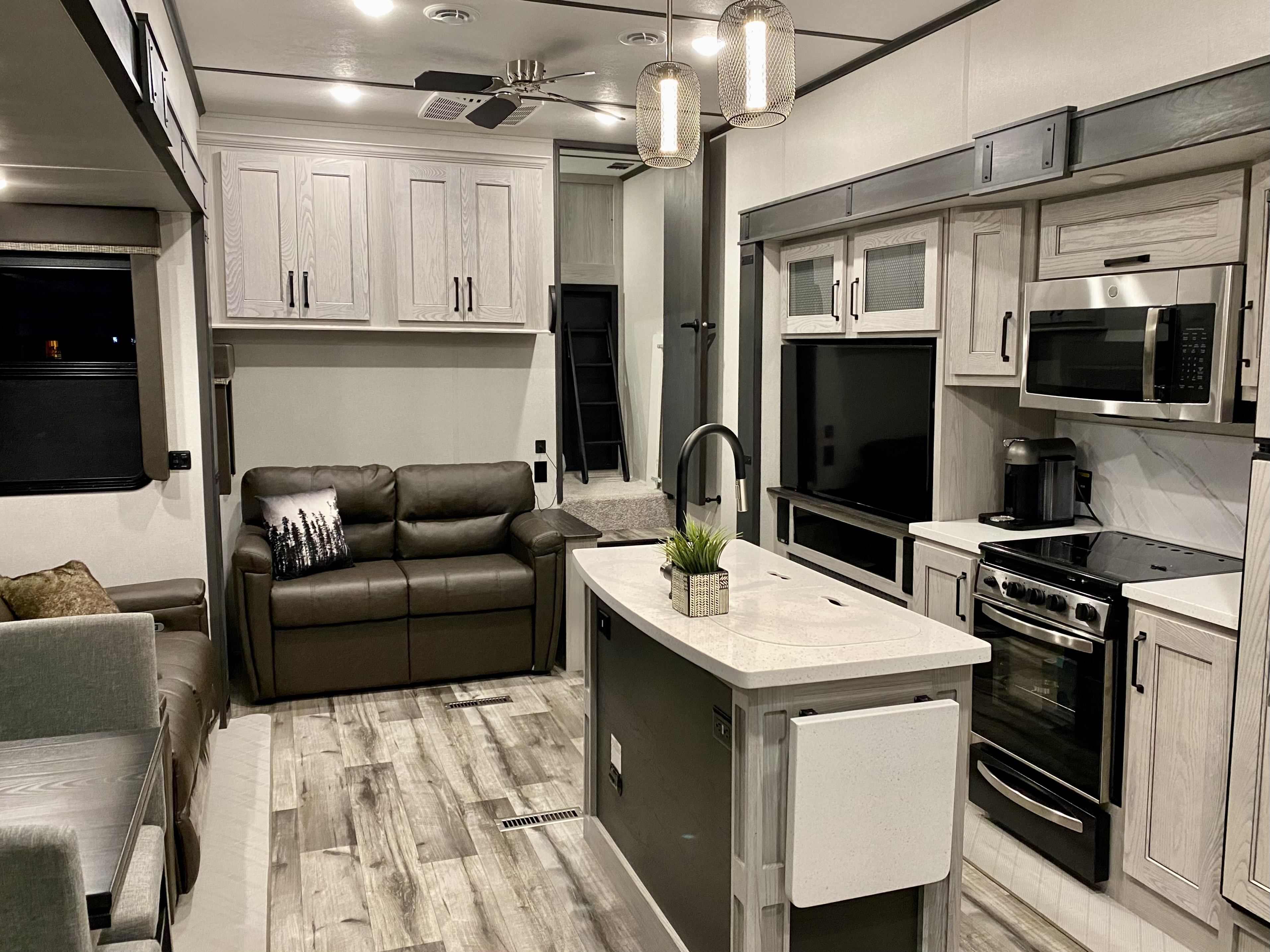 The kitchen and living area of the Roy's Keystone Montana fifth wheel