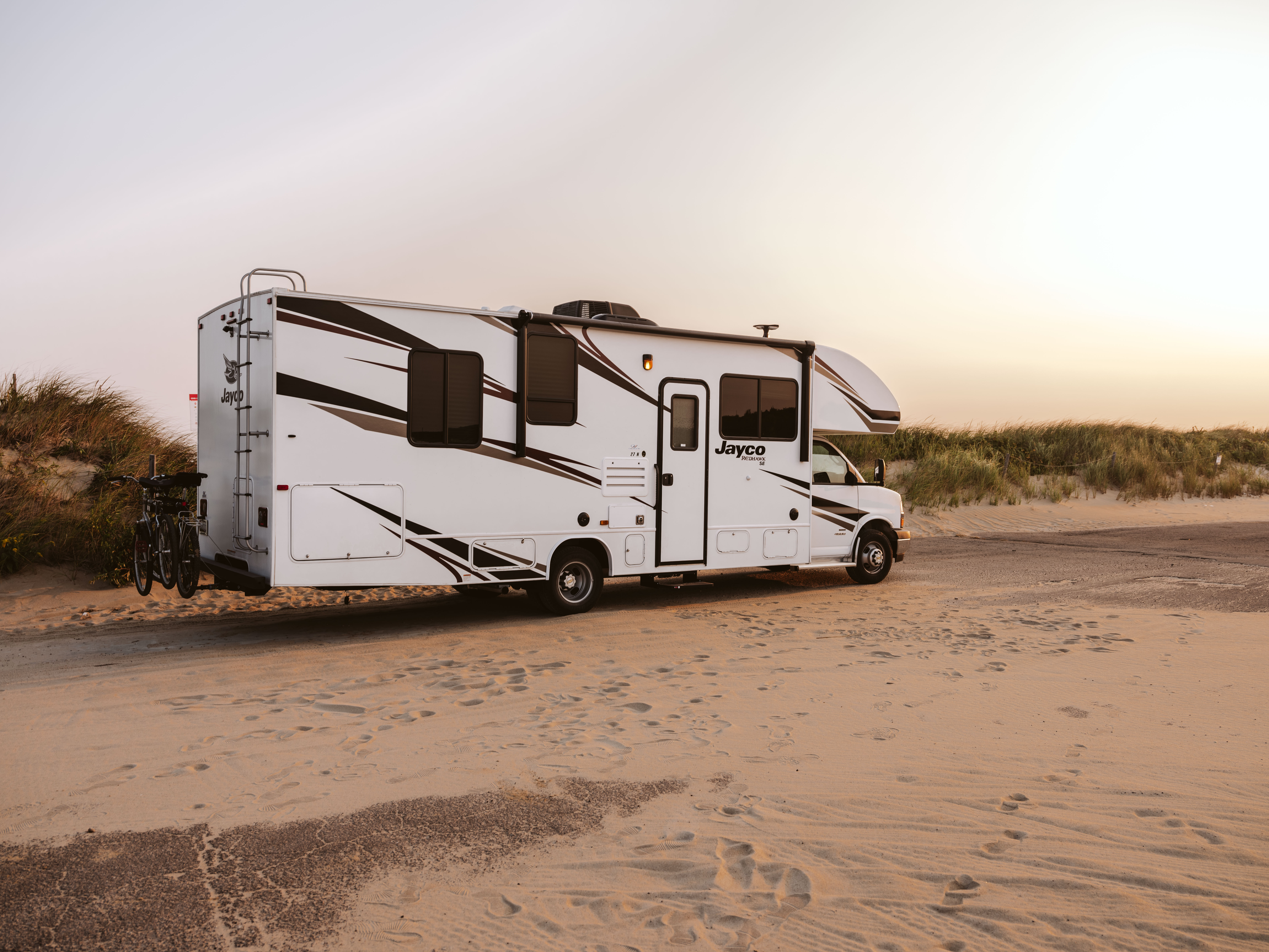 Sonya Lowery's Jayco Redhawk parked by the ocean.