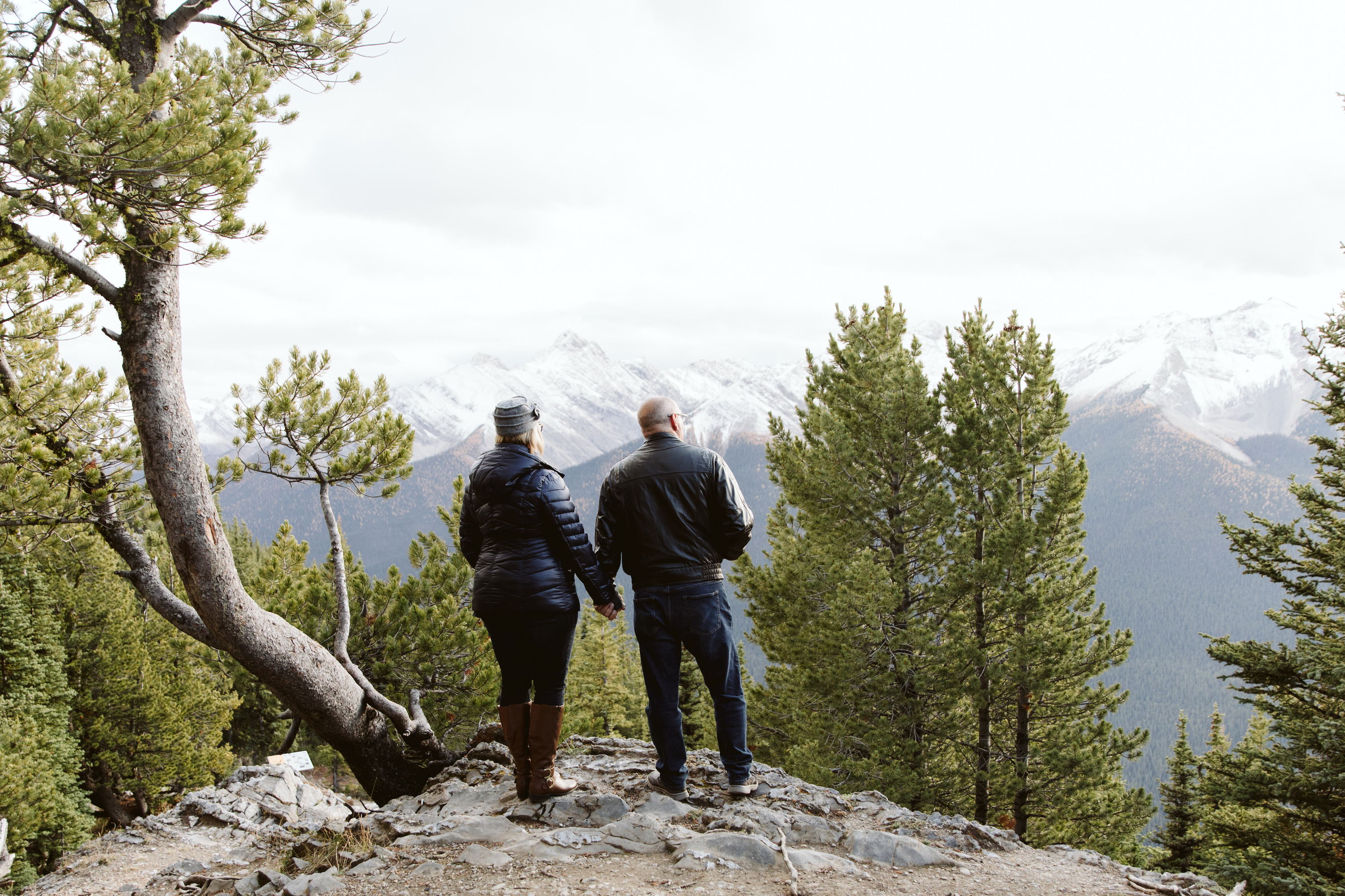A couple admiring the mountain scenery. 