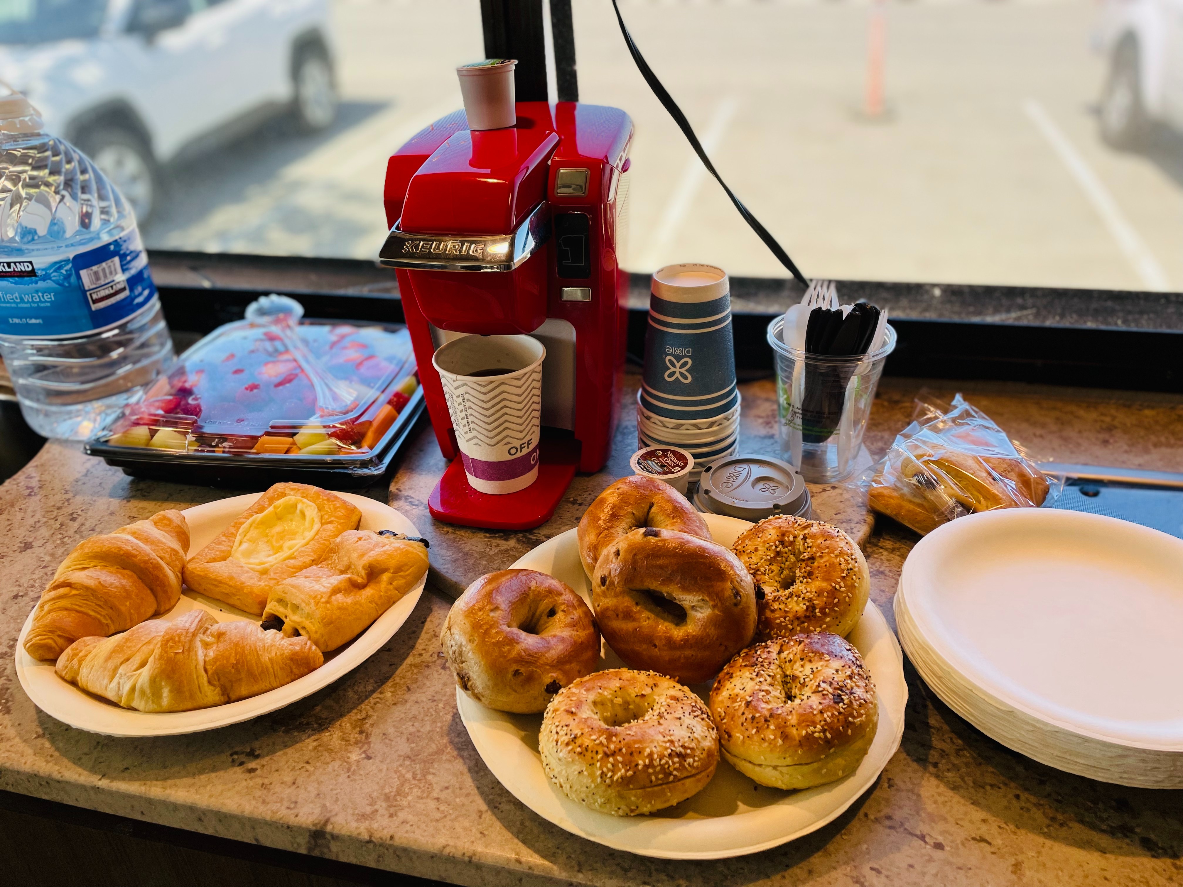 A breakfast spread with bagels and coffee inside Brenda Huynh and Tiger Doan's Thor Motor Coach Vegas Class A motorhome