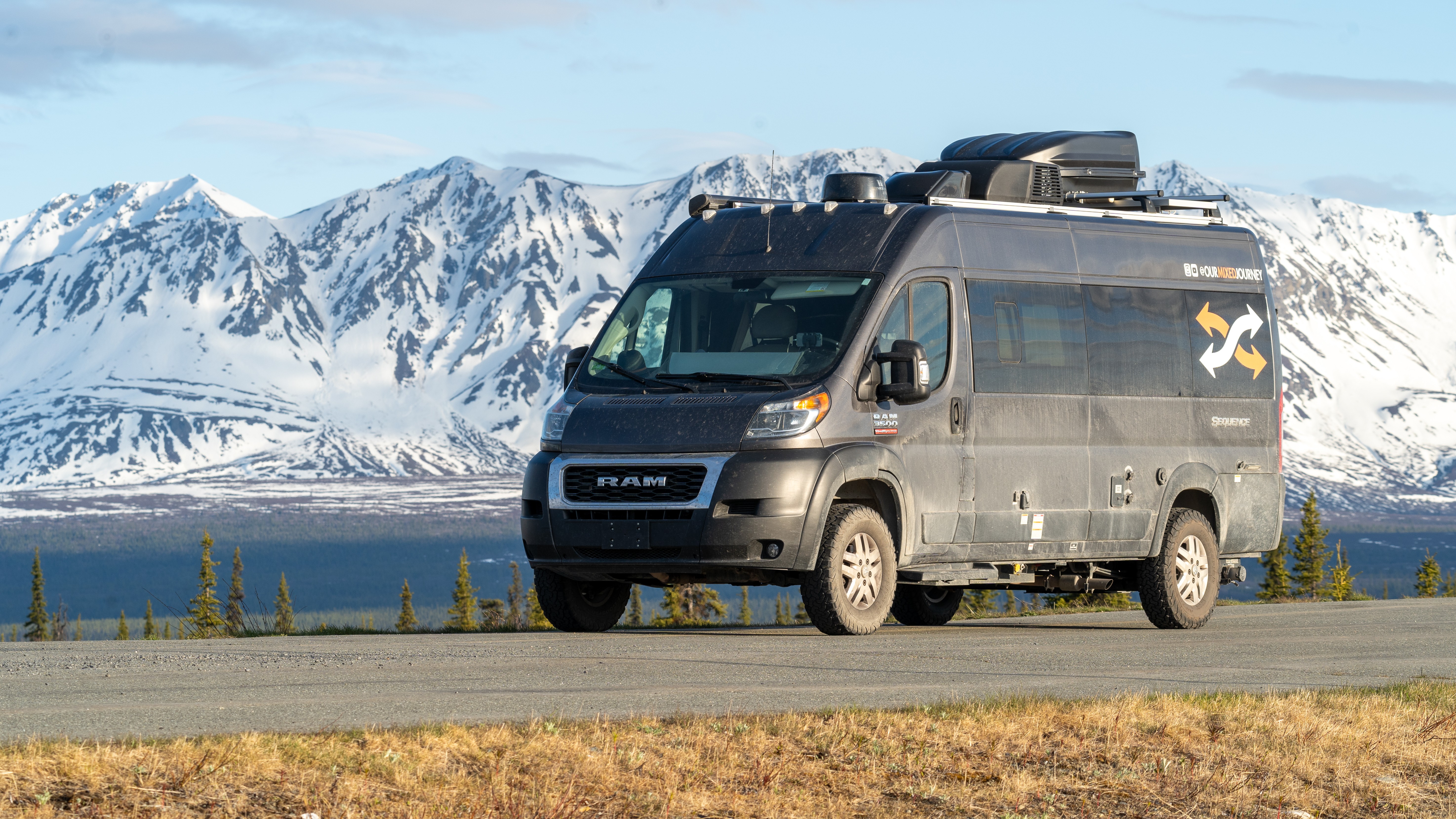Gabe and Rocio Rivero's 2021 Thor Motor Coach Sequence 20L with mountains in the background 