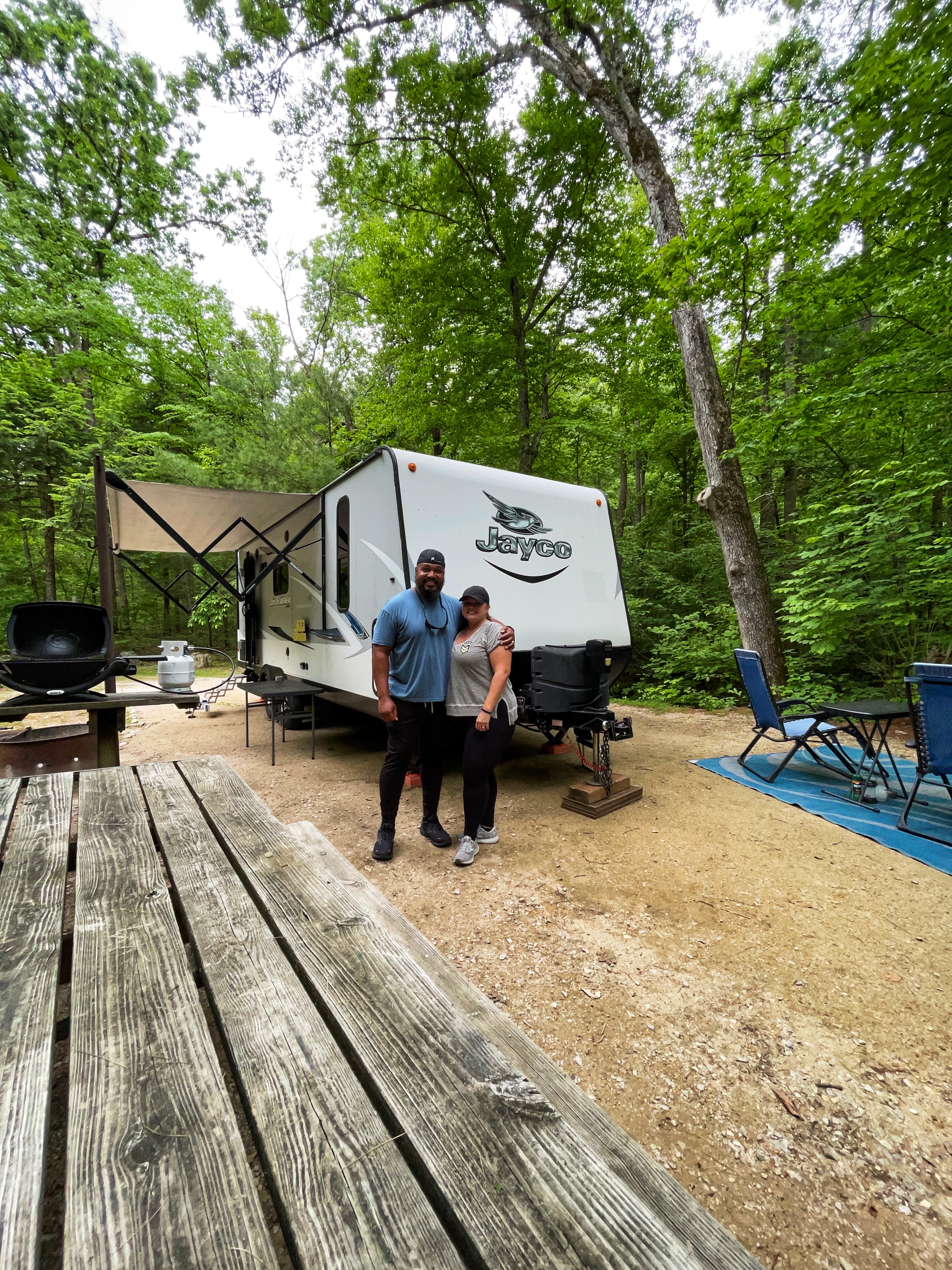 Christina and Ben McMillan in front of their RV in George Washington and Jefferson National Forest