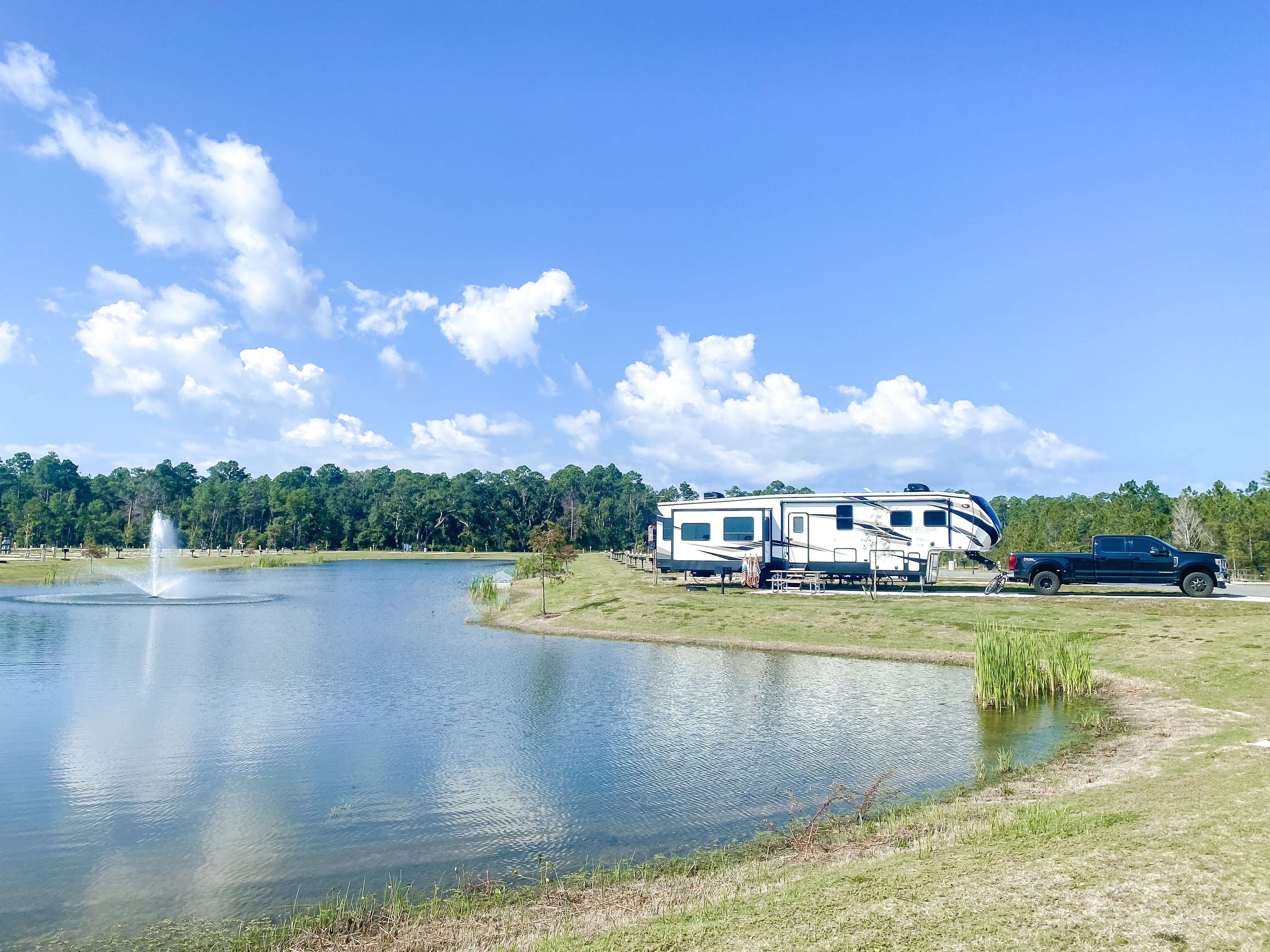 The Darren and Amanda Bone family Heartland Bighorn parked outside near a pond