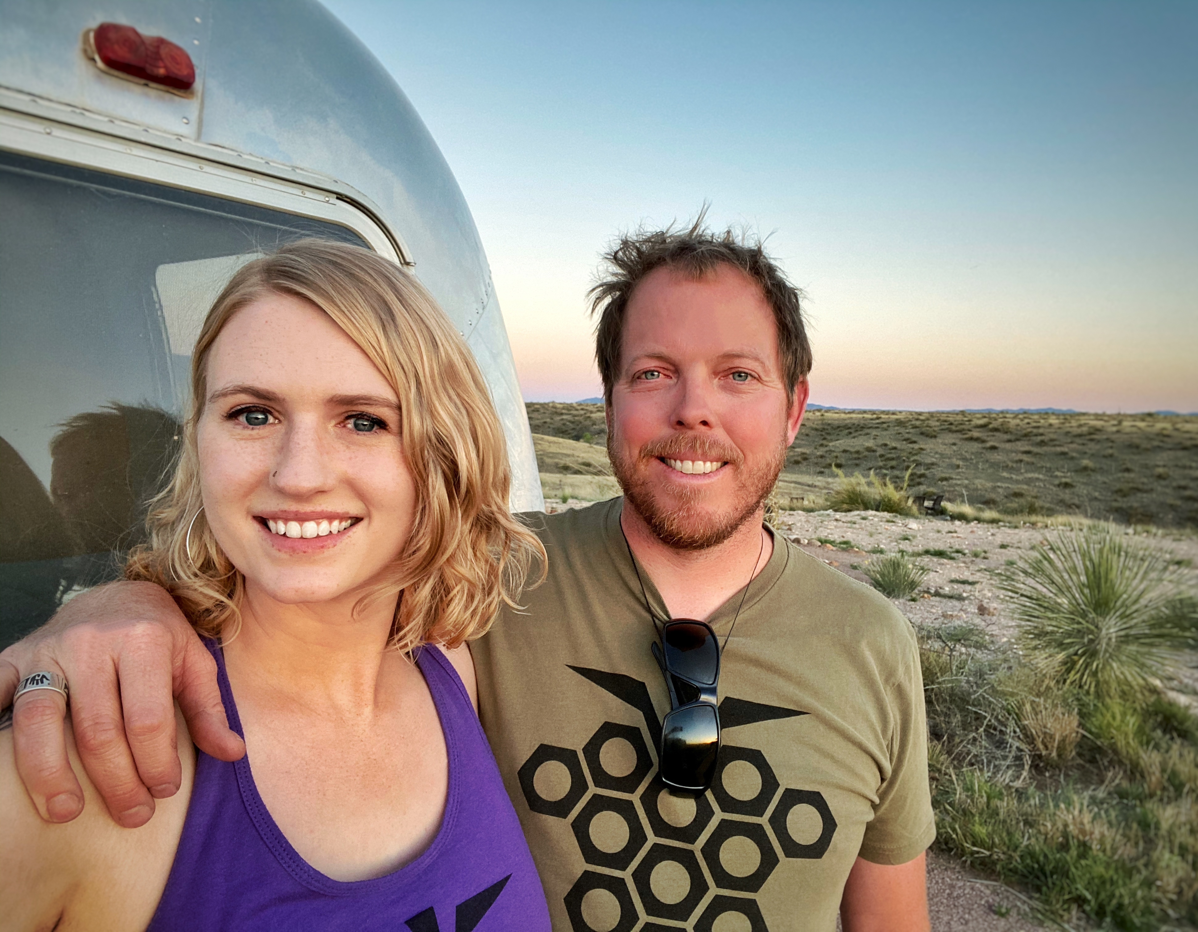 Anna and James posed for a photo in the desert.