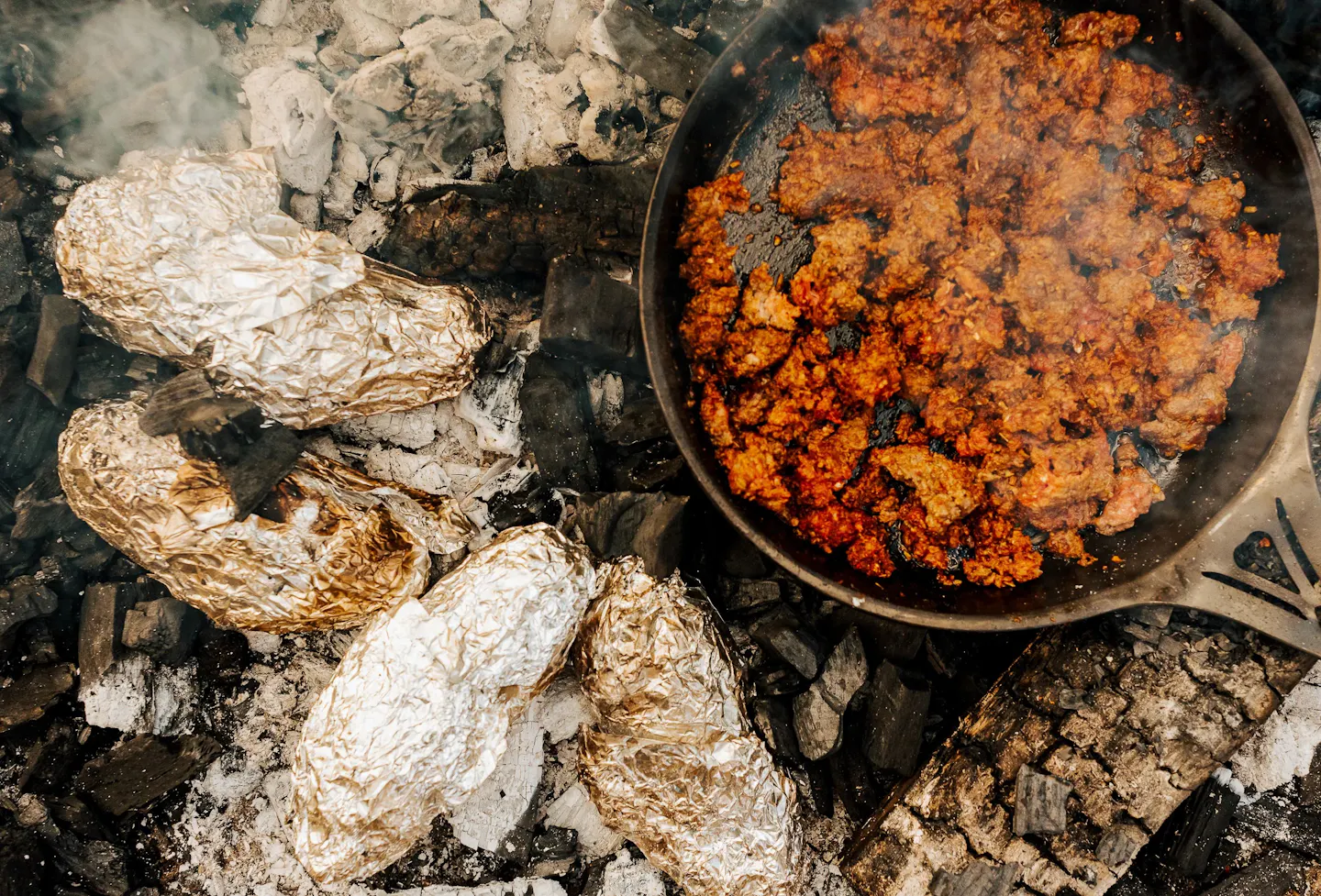 pork and venison cooking in a skillet
