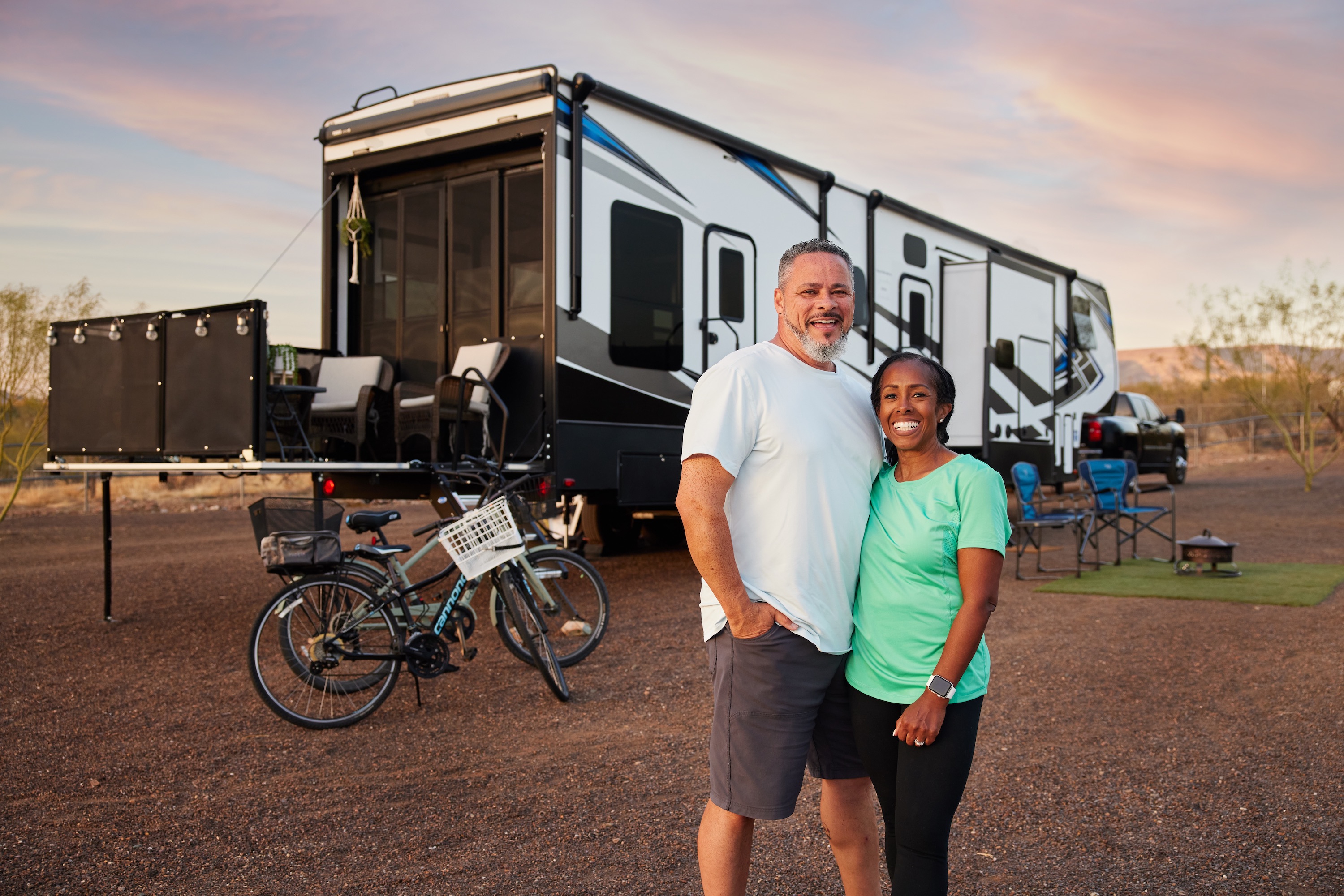 Robin and Warren pose for a picture in front of their Keystone Fuzion.