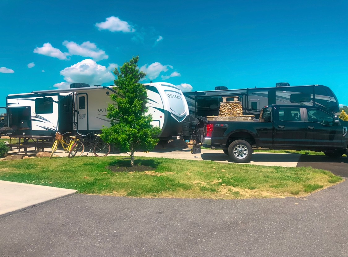 A travel trailer RV parked at a campsite