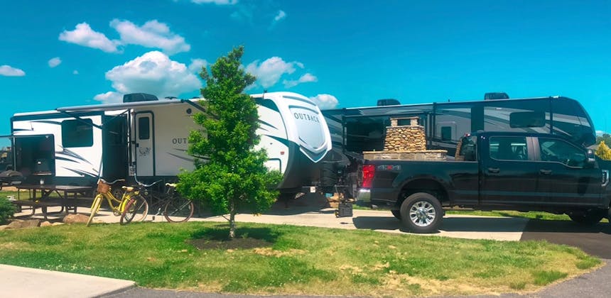 A travel trailer RV parked at a campsite